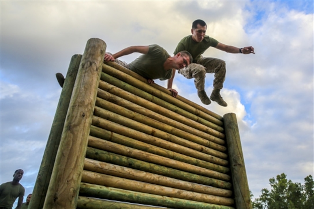 Marines complete an obstacle course as fast as possible during a weeklong squad competition on Robertson Barracks, Darwin, Australia, June 4, 2014. The competition is part of a combined training opportunity with the Australian military. 