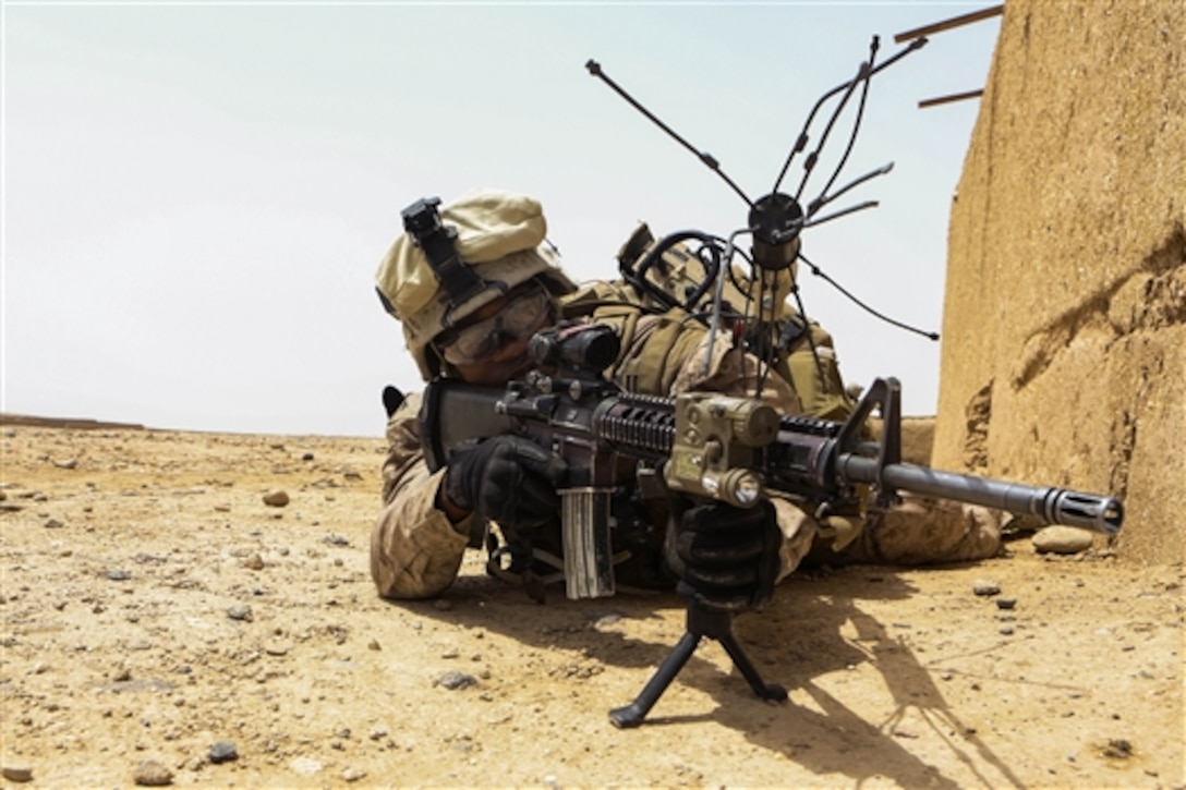 U.S. Marine Corps Lance Cpl. Jean Vil provides security during a reconnaissance patrol near Patrol Base Boldak in Helmand province, Afghanistan, May 15, 2014. Vil, a mortarman, is assigned to Charlie Company, 1st Battalion, 2nd Marine Regiment. 