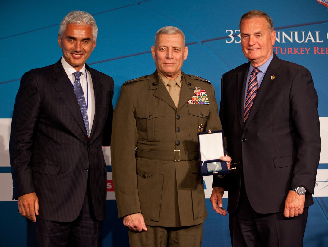 From the left, Haluk Dincer; the Assistant Commandant of the Marine Corps, Gen. John M. Paxton, Jr.; and Ret. Gen. James L. Jones, Jr., pose for a photo during the 33rd annual conference on U.S.-Turkish Relations in Washington, D.C., June 2, 2014. (U.S. Marine Corps photo by Cpl. Tia Dufour/Released)