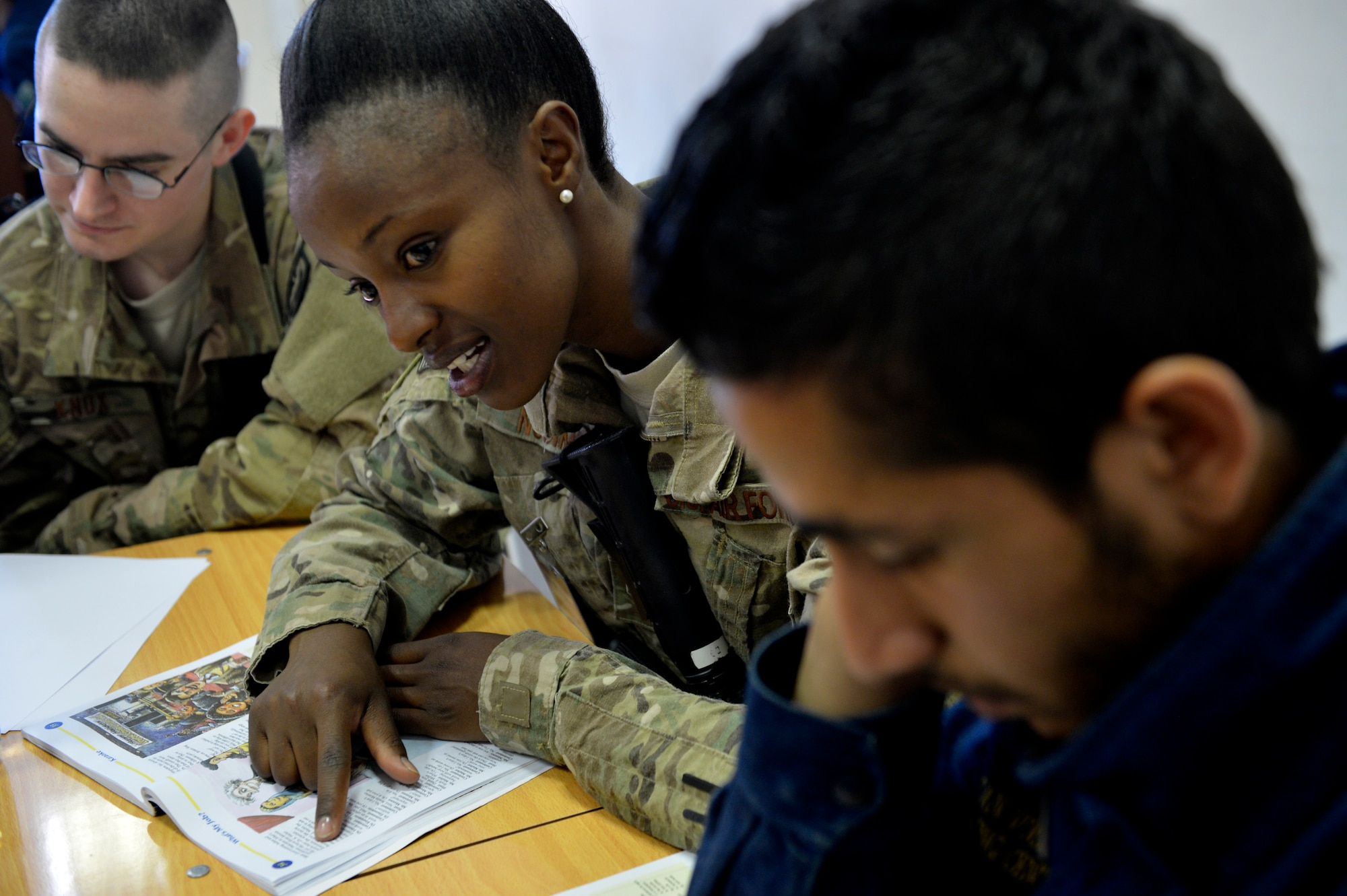 Staff Sgt. Linette Nosim teaches Afghan students English May 21, 2014, at Bagram Airfield, Afghanistan. Nosim volunteers at the Korean Vocational Training Center to help improve the student’s language skills. Nosim is the 455th Expeditionary Logistics Readiness Squadron traffic management office receiving supervisor (U.S. Air Force photo/Staff Sgt. Evelyn Chavez)