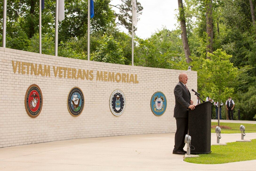 Ray Smith, a retired major general who served during the Tet Offensive in 1968 and participated in combat operations at Ue, Khe Sahn, the Rockpile, Con Thien and Dodge City south of Danang, speaks during the Vietnam Veterans Memorial rededication ceremony  at Lejeune Memorial Gardens in Jacksonville, N.C., May 31. The ceremony honored the memory of those who perished during the war and celebrated the accomplishments and perseverance of Vietnam-era veterans.(U.S. Marine Corps photo by Cpl. Jackeline M. Perez Rivera/Released)