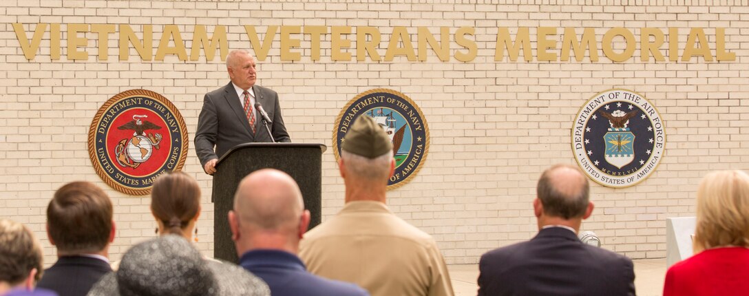 Ray Smith, a retired major general who served during the Tet Offensive in 1968 and participated in combat operations at Ue, Khe Sahn, the Rockpile, Con Thien and Dodge City south of Danang, speaks during the Vietnam Veterans Memorial rededication ceremony  at Lejeune Memorial Gardens in Jacksonville, N.C., May 31. The ceremony honored the memory of those who perished during the war and celebrated the accomplishments and perseverance of Vietnam-era veterans.(U.S. Marine Corps photo by Cpl. Jackeline M. Perez Rivera/Released)