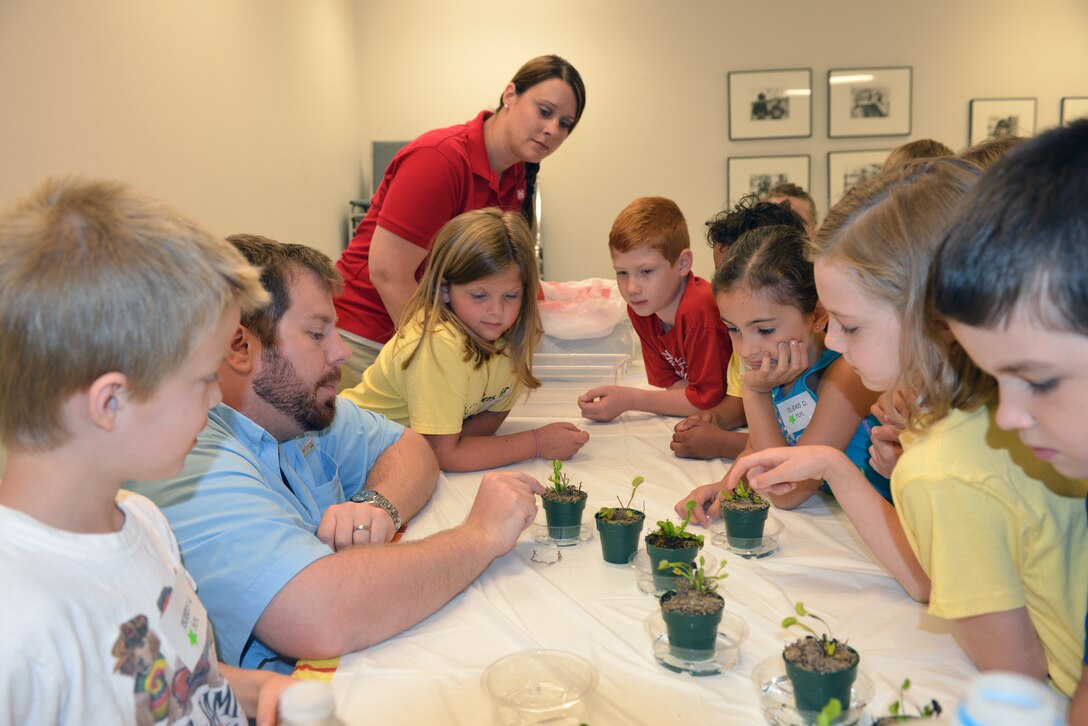 Casey Ehorn, a wetland biologist  with the U.S. Army Corps of Engineers Nashville District Regulatory  Branch, talks to  kids at the Williamson County Junior Gardener Camp at the Agricultural Exposition Park June 3, 2014 as Mary Lewis (left) also a biologist from the planning branch. 