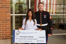 Georgia Llanas, a senior at Muskego High School, poses for a photo with her recruiter, Sgt. Bryan Bell, after receiving the Naval Reserve Officer Training Corps scholarship June 4, 2014.  Llanas will enter college this fall at Marquette University as a Marine-option midshipman pursuing a degree in engineering.