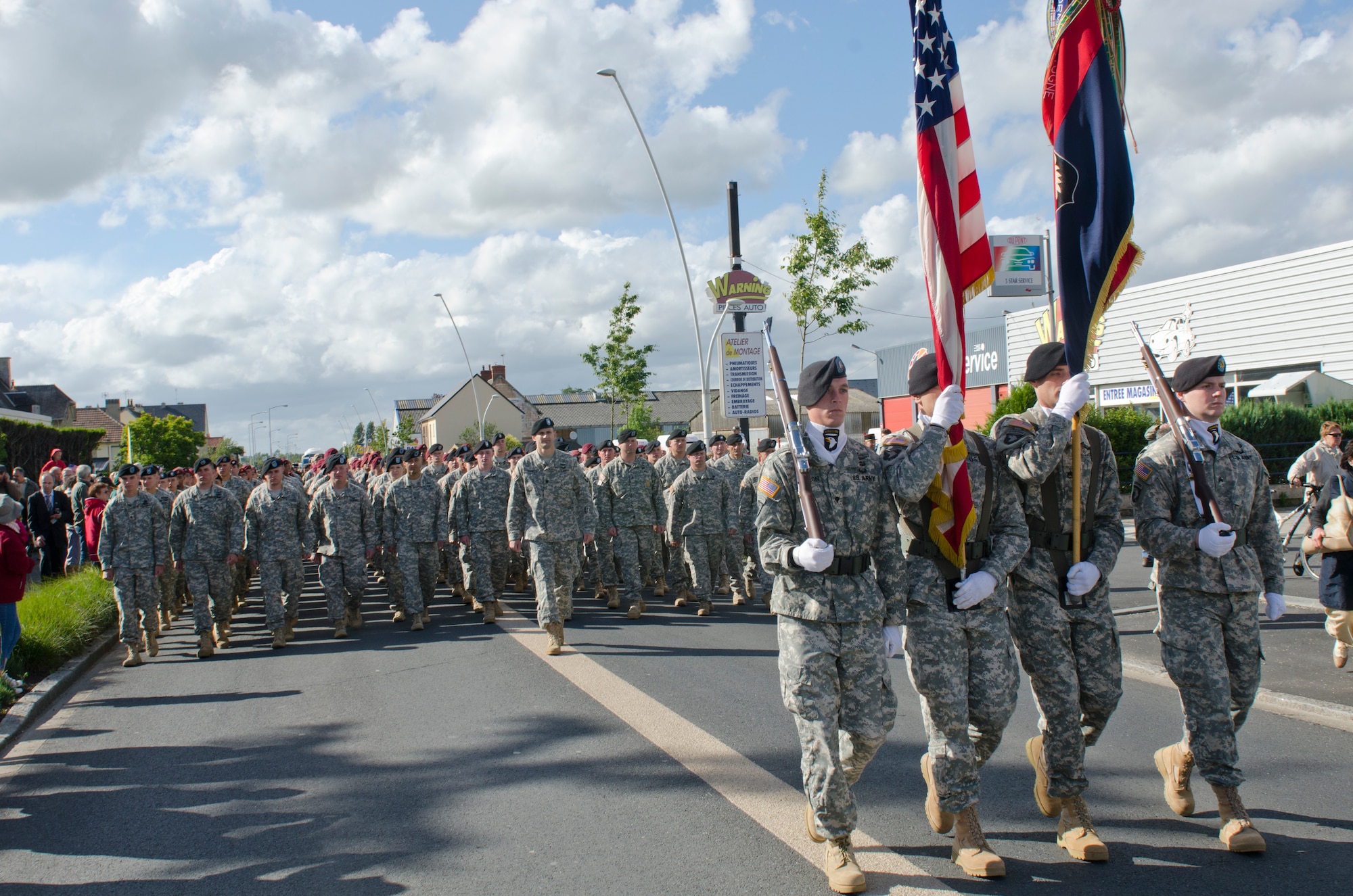 Soldiers from the 101st Airborne Division, along with allied troops from multiple countries, participate in a parade June 4, 2014, through the streets of Carentan, France. The town is hosting several events commemorating the 70th anniversary of D-Day operations conducted during World War II. (U.S. Army photo/Sgt. A.M. LaVey)