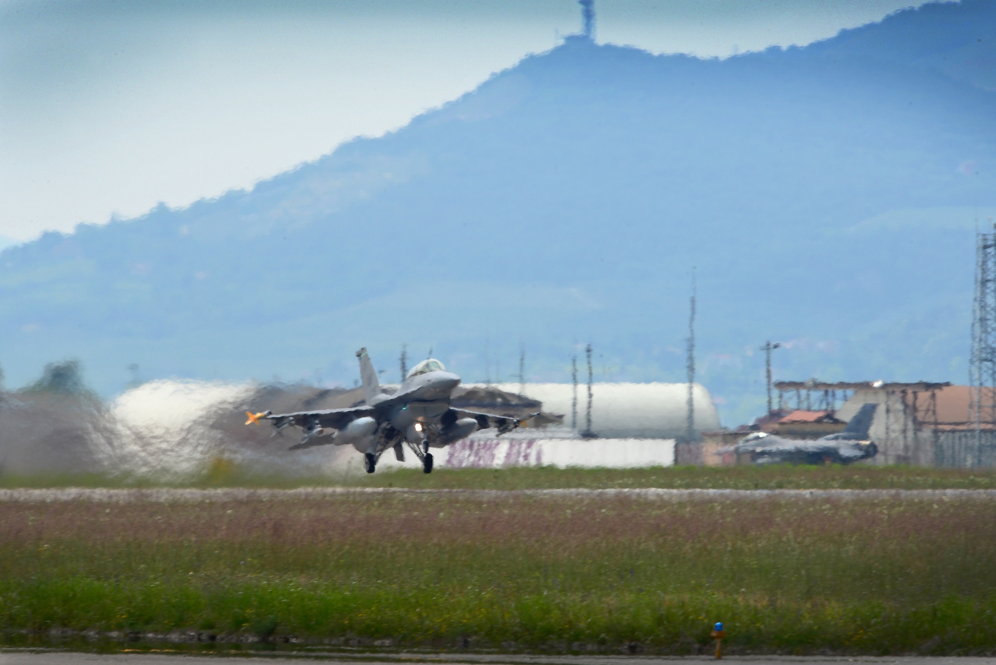 An F-16 Fighting Falcon assigned to the 555th Fighter Squadron takes off from Aviano Air Base, Italy, to participate in Exercise ADRIATIC STRIKE in Postojna, Slovenia, June 4, 2014. The ability of the 31st Fighter Wing pilots, aircraft and support personnel to operate from home station maximizes training effectiveness while minimizing costs. (U.S. Air Force photo/Senior Airman Matthew Lotz)