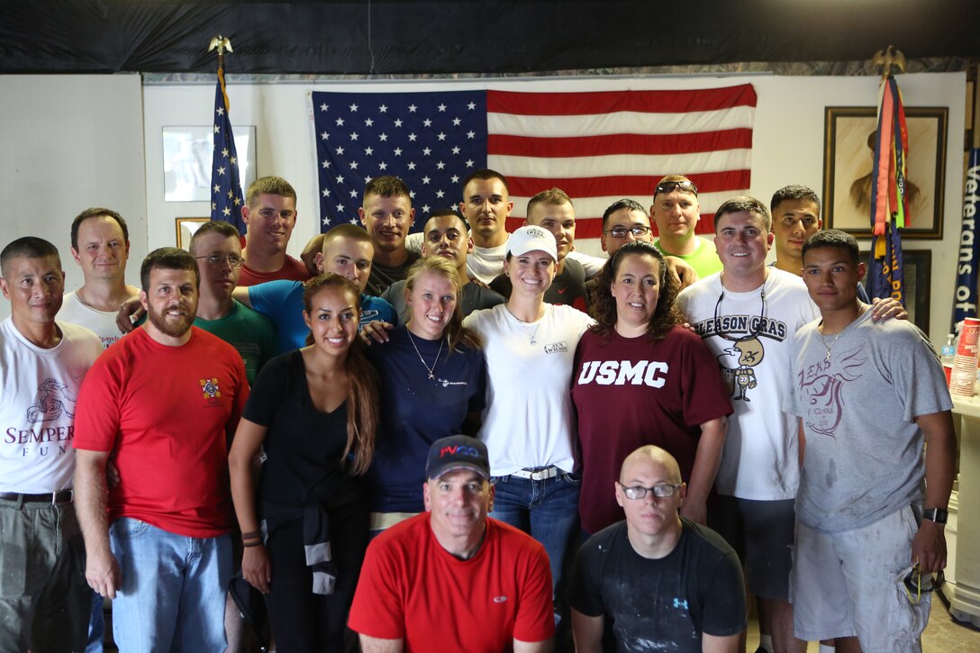 Sergeant Major Bryan B. Battaglia, senior enlisted advisor to the Chairman of the Joint Chiefs of Staff, poses with Marines from Marine Forces Reserve, Naval Air Station-Joint Reserve Base Belle Chasse, and other volunteers for a group photo in the Veterans of Foreign Wars Post 8973, June 4, 2014. The volunteers helped renovate the post to provide a place for veterans to go for Veterans Affairs claims, résumé and interviewing workshops, free legal clinics and more. (U.S. Marine Corps photo by Lance Cpl. Sara Graham)