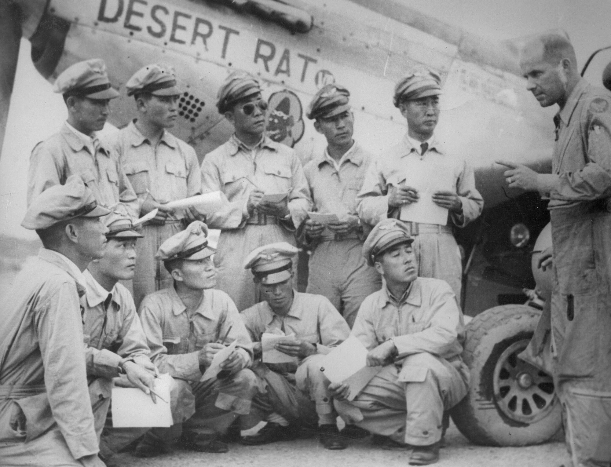 The first Buddy Wing exchange was in 1950, pictured here as Lt. Col. Jason Crum instructs Republic of Korea pilots on the F-51. Sixty-four years later, the United States and ROKAF still honor the Buddy Wing tradition. (Courtesy Photo)