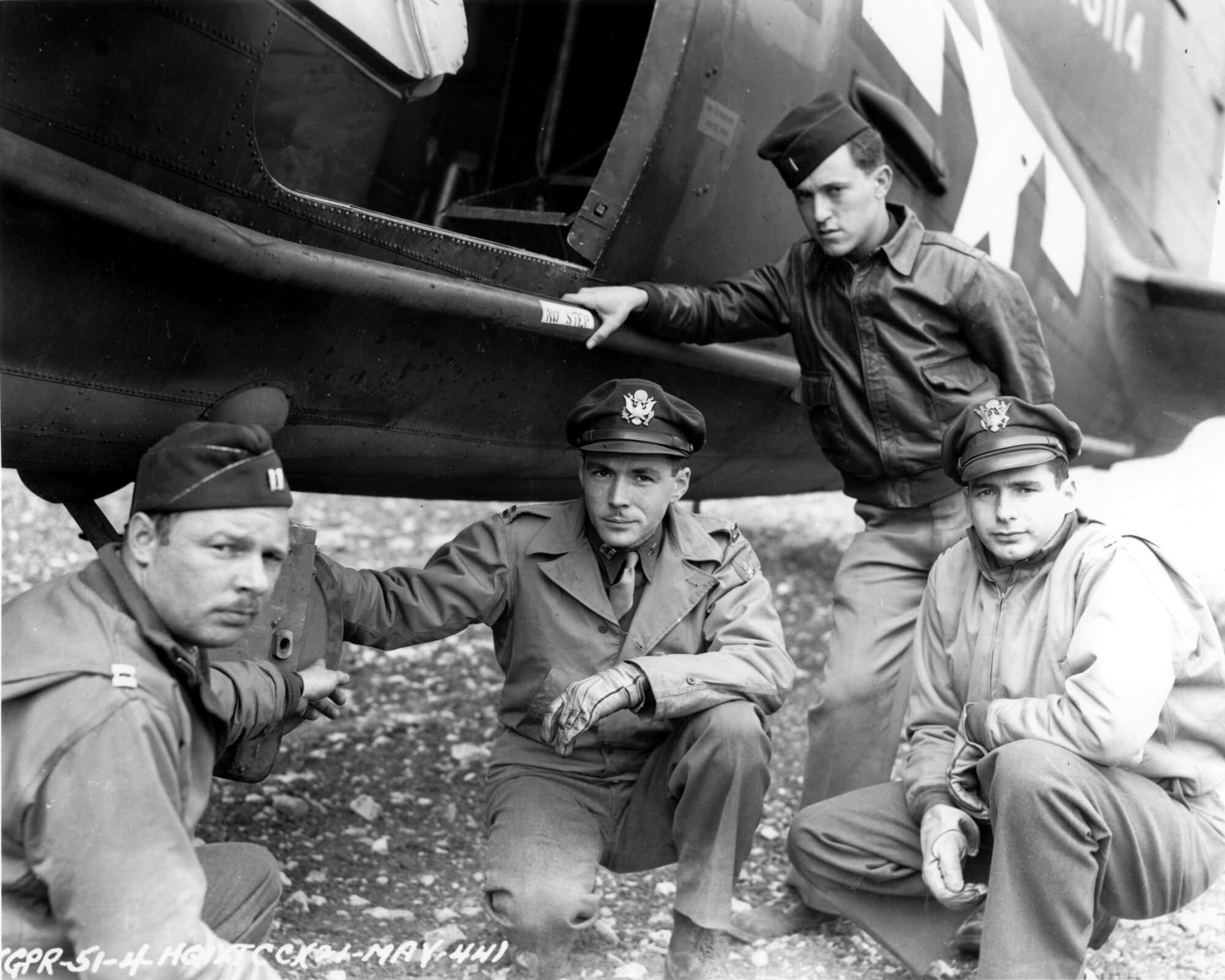 Crew members from the 32nd Troop Carrier Squadron stop for a photo opportunity in front of a C-47. (Courtesy photo)