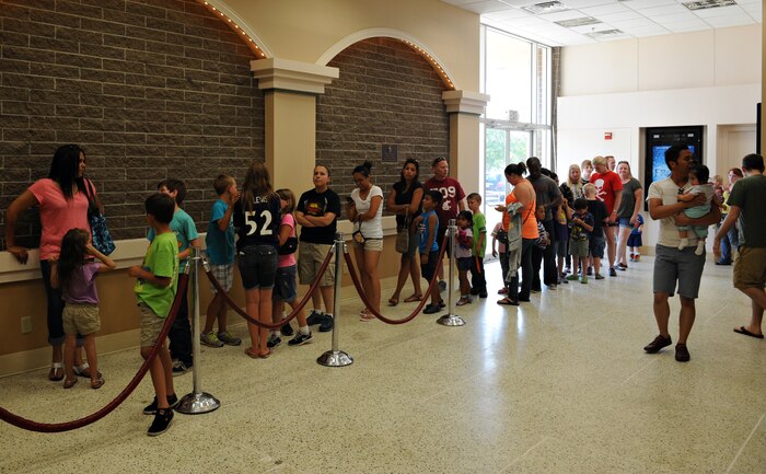 Members of Team Beale wait in line for popcorn and refreshments before the start of a movie June 4, 2014, at Beale Air Force, Calif. The theater recently underwent upgrades to include a new high-definition digital projector, an audio system provided by the 9th Communication Squadron, and a new snack bar. (U.S. Air Force photo by Airman 1st Class Ramon A. Adelan/ released)