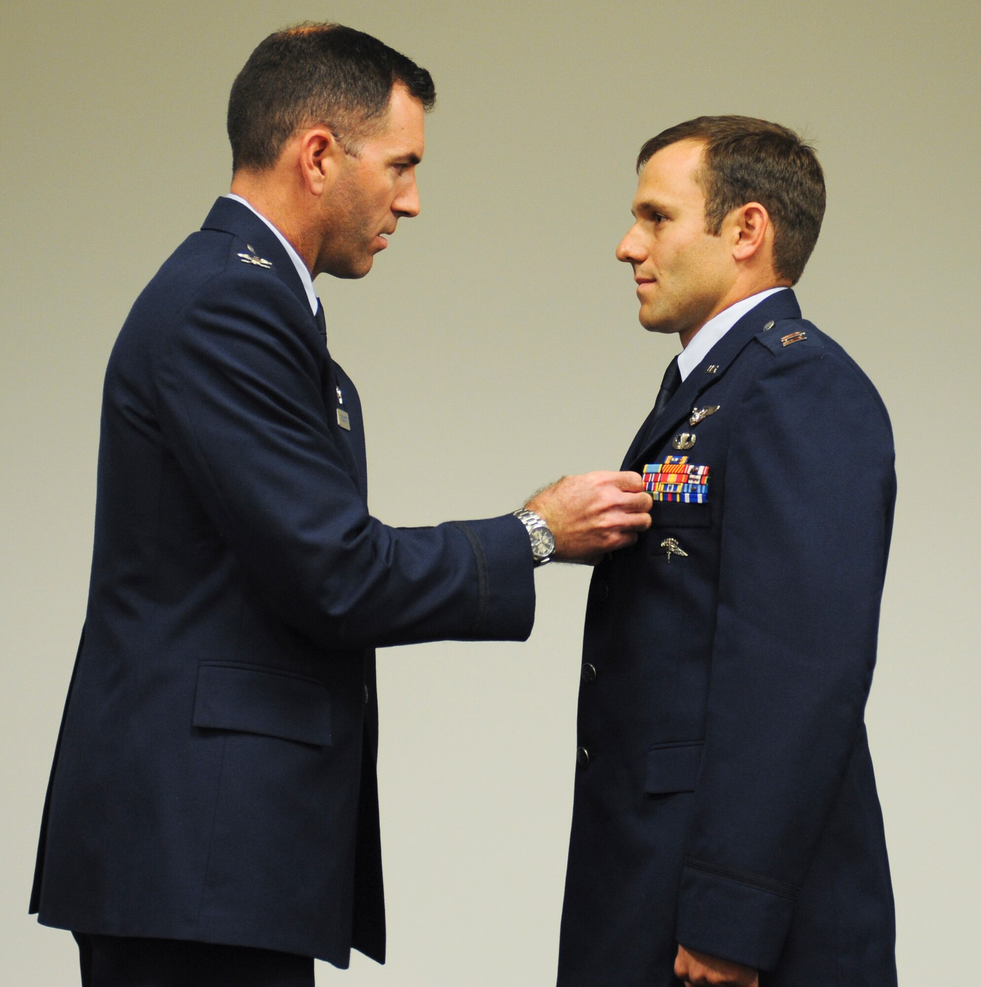 U.S. Air Force Capt. Kevin Epstein, 48th Rescue Squadron combat rescue officer, receives a Bronze Star Medal with valor from Col. Sean Choquette, 563rd Rescue Group commander, at Davis-Monthan Air Force Base, Ariz., June 2, 2014. The Bronze Star Medal is the fourth highest individual military award and the ninth highest by order of precedence in the U.S. Military. It may be awarded for acts of heroism, merit, or meritorious service in a combat zone. (U.S. Air Force photo by Senior Airman Sivan Veazie/Released)