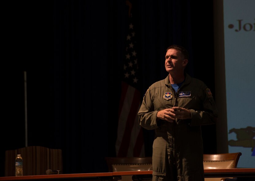 Retired U.S. Air Force Lt. Col. Bill Denehan, MH-60G Pave Hawk pilot, talks about the Hammer 34 combat search and rescue (CSAR) mission to save Lt. Col. David Goldfein, F-16CG Fighting Falcon pilot, during the CSAR Society Symposium at Moody Air Force Base, Ga., May 30, 2014. Goldfein’s F-16CG was shot down during Operation Allied Force in May 1999, when he was forced to eject out of the aircraft in enemy territory. (U.S. Air Force photo by Airman Dillian Bamman/Released)