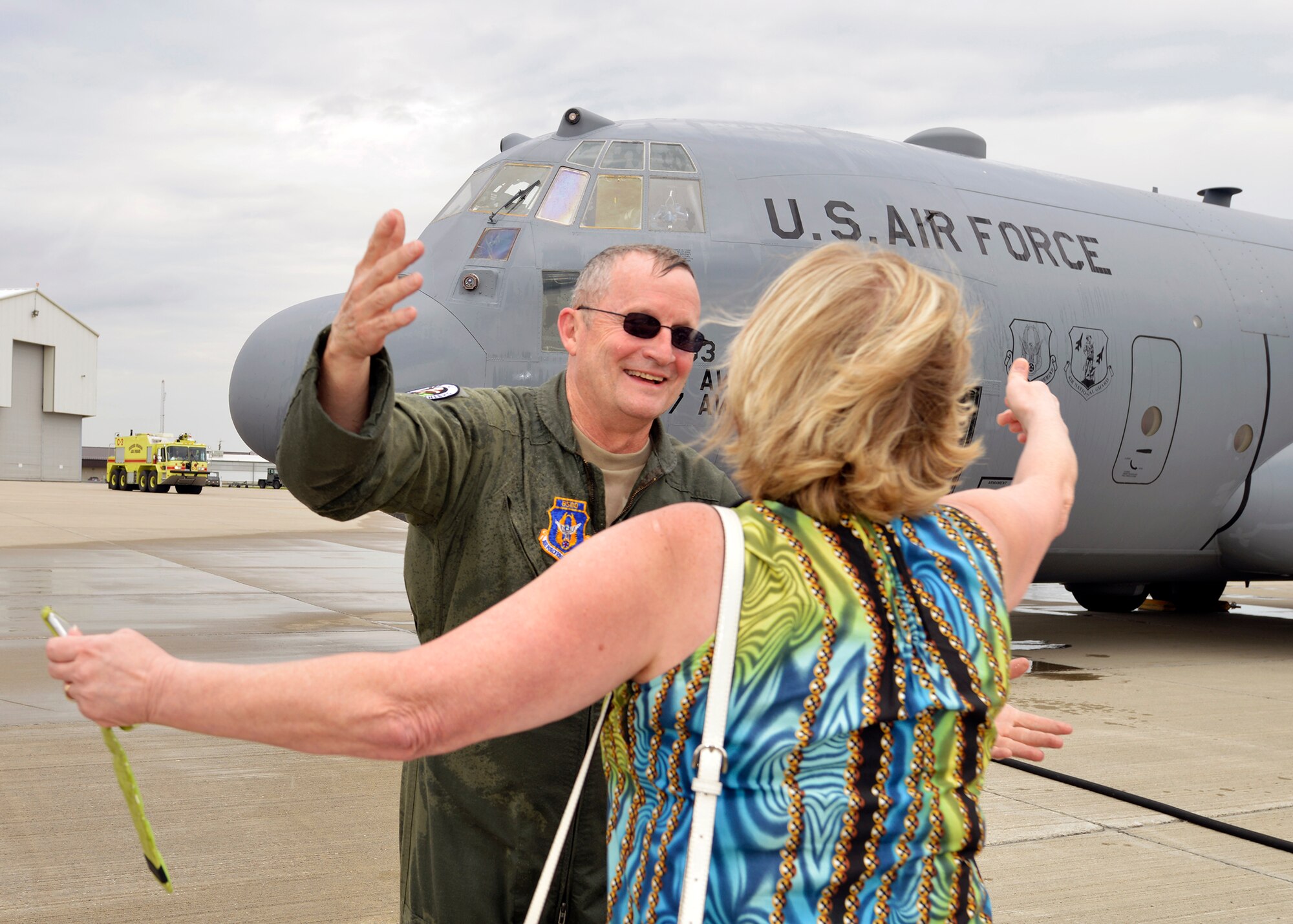Chief Master Sgt. Jack Webster, 328th Airlift Squadron Chief Flight Engineer, is greeted as he returns from his final (fini) military flight aboard a C-130 aircraft May 13, 2014 at the Niagara Falls Air Reserve Station, N.Y. Chief Webster retires from the Air Force with 38 years of service.  (U.S. Air Force photo by Tech. Sgt. Joseph McKee)