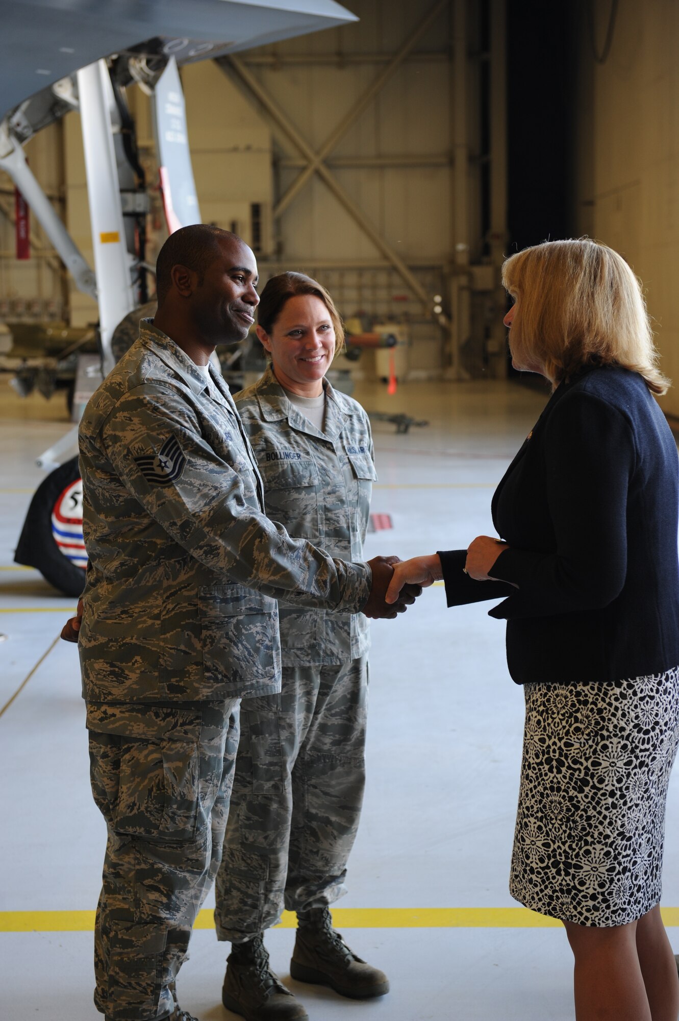 Tech Sgt. Broderick Jones, 509th Aircraft Maintenance Squadron and Tech Sgt. Ronda Bollinger, 131st Air Craft Maintenance Squadron shake hands with Secretary of the Air Force Deborah Lee James during her tour of a B-2 Spirit at Whiteman Air Force Base, Mo., May 29, 2014. James visited Team Whiteman to learn about the B-2 and overall mission of the base, while interacting with Airmen and sharing her vision for tomorrow’s Air Force. (U.S. Air Force photo by Airman 1st Class Joel Pfiester/Released)