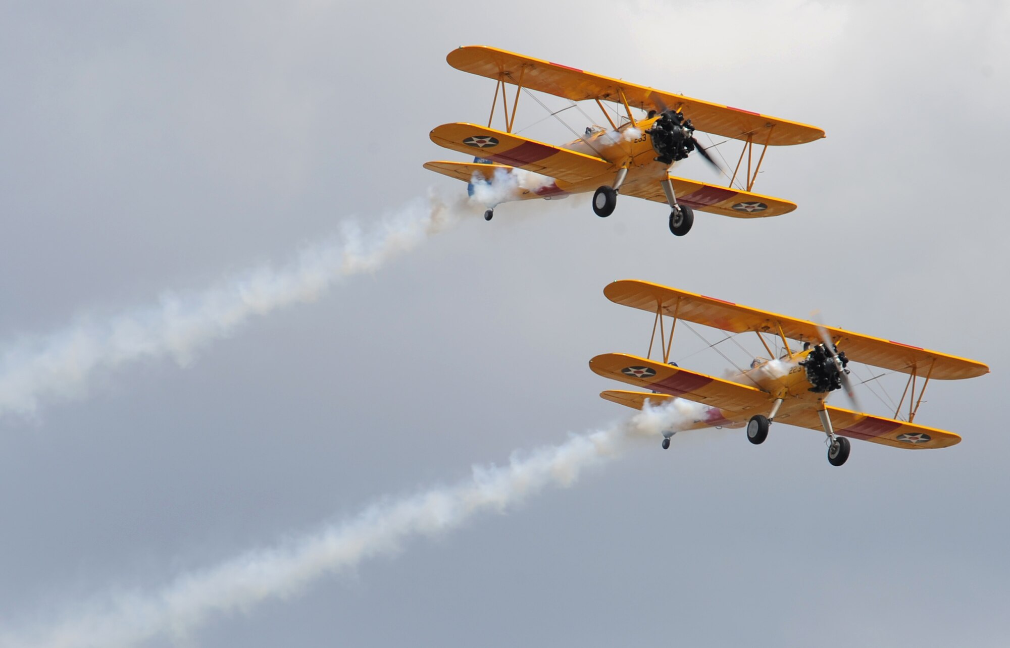 Stearman pilots perform maneuvers during SkyFest 2014 at Fairchild Air Force Base, Wash., June 1, 2014. The Stearman Flight organization was formed in 2008 by a group of aviators and provides Federal Aviation Administration-authorized formation flight training for pilots. SkyFest is Fairchild’s air show and open house, giving the local and regional community the opportunity to view Airmen and our resources. The event typically draws more than 150,000 people. SkyFest 2008, headlined by the Blue Angels, was the largest event held in Spokane since the 1974 World’s Fair. (U.S. Air Force photo by Airman 1st Class Janelle Patiño/Released)