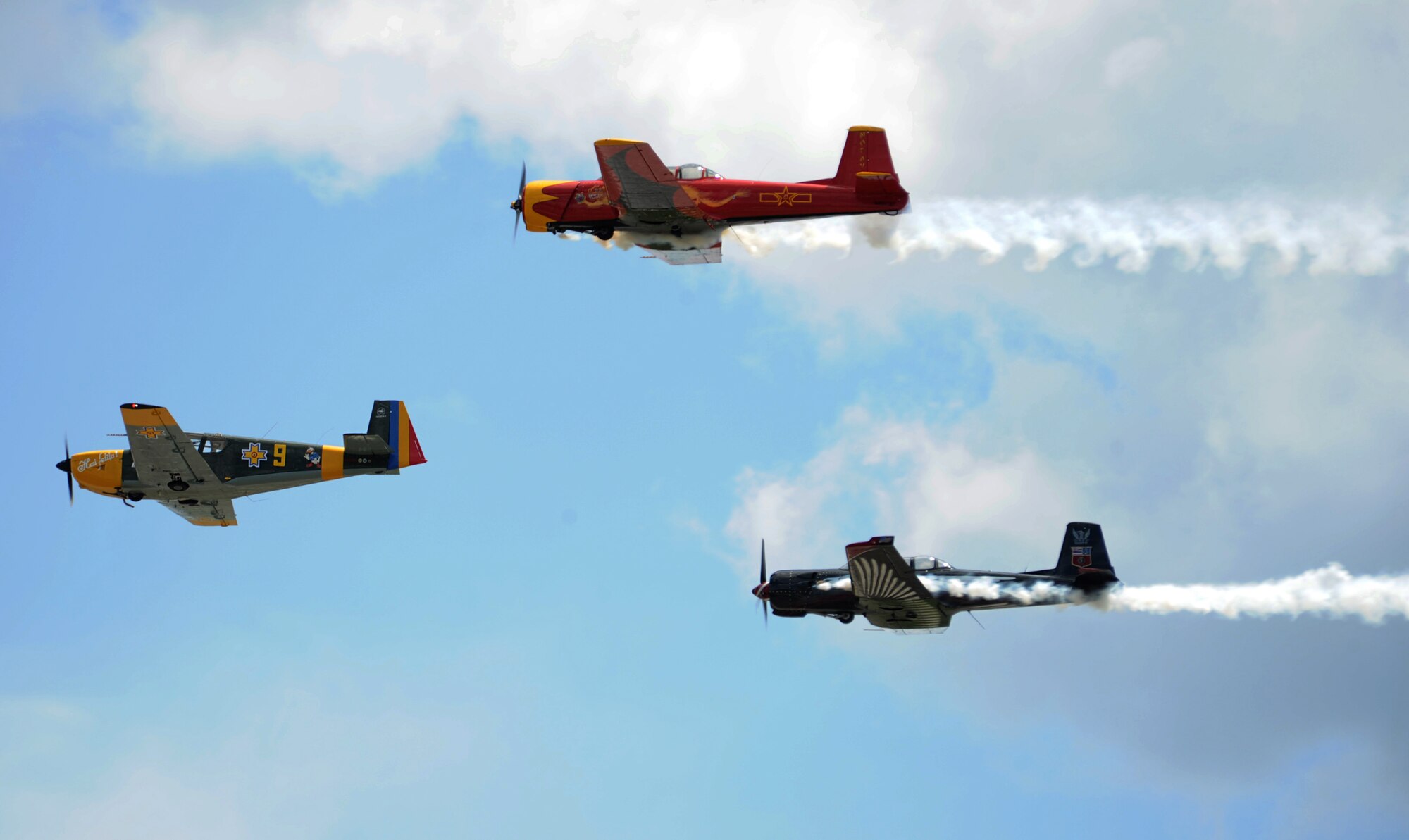 The Cascade Warbirds perform during SkyFest 2014 at Fairchild Air Force Base, Wash., May 31, 2014. The Warbirds fly vintage U.S. military aircraft in varying formations performing breathtaking maneuvers for audiences around the world. SkyFest is Fairchild’s air show and open house, giving the local and regional community the opportunity to view Airmen and our resources. The event typically draws more than 150,000 people. SkyFest 2008, headlined by the Blue Angels, was the largest event held in Spokane since the 1974 World’s Fair. (U.S. Air Force photo by Airman 1st Class Janelle Patiño/Released)