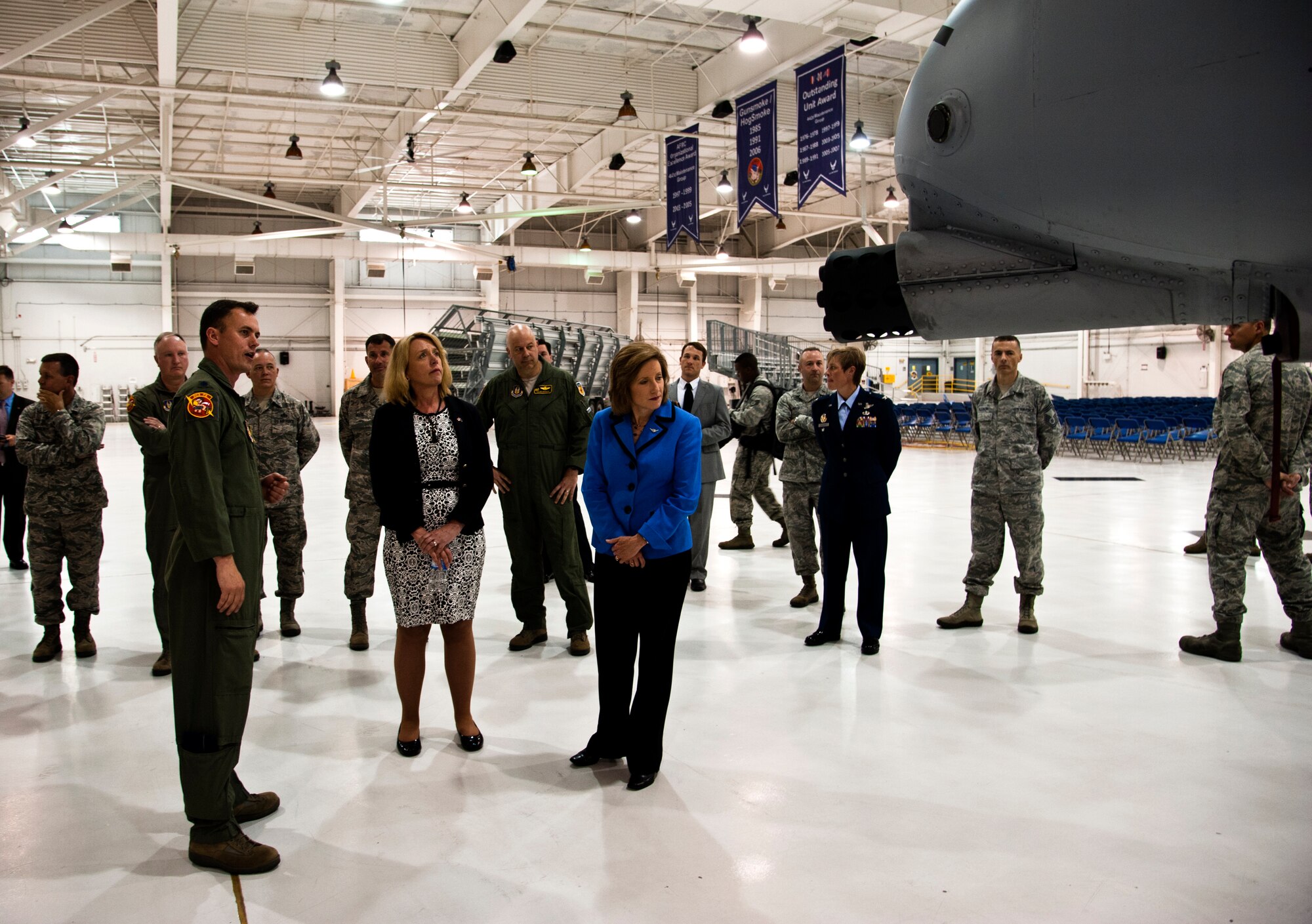 Lt. Col. Dennis Saugstad, 303rd Fighter Squadron A-10 Thunderbolt II pilot, shares war stories highlighting the capabilities of the A-10 to Secretary of the Air Force Deborah James and Congresswoman Vicky Hartzler (MO-4) May 29, 2014 at Whiteman Air Force Base, Mo. James and Hartzler visited Whiteman to learn about the installation’s various capabilities and meet the people who make the mission happen. (U.S. Air Force photo by Senior Airman Daniel Phelps/Released)