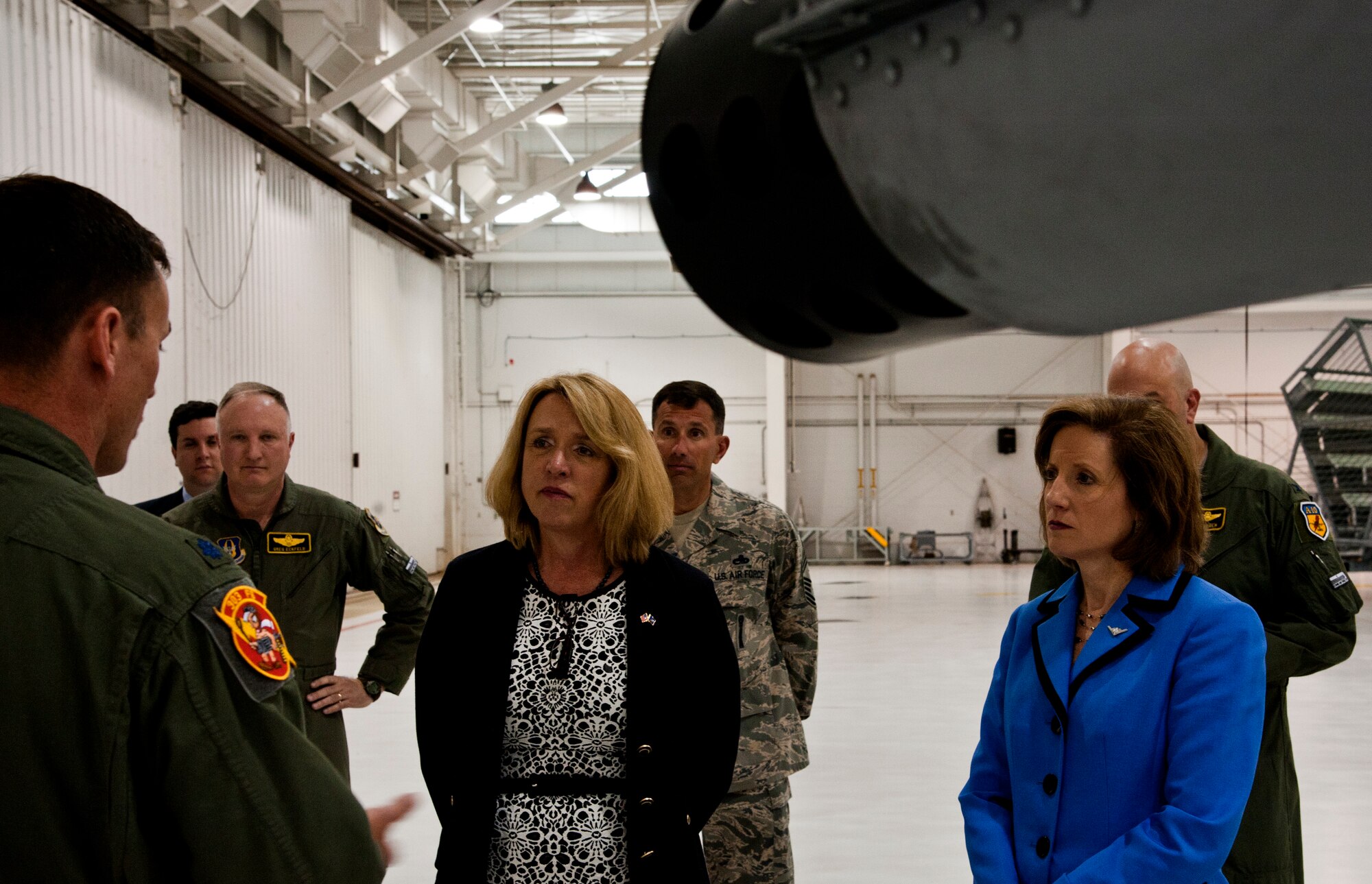 Lt. Col. Dennis Saugstad, 303rd Fighter Squadron A-10 Thunderbolt II pilot, tells Secretary of the Air Force Deborah James and Congresswoman Vicky Hartzler (MO-4) why he came to Whiteman Air Force Base, Mo. after an active duty career May 29, 2014. James and Hartzler visited Whiteman to learn about the installation’s various capabilities and meet the people who make the mission happen. (U.S. Air Force photo by Senior Airman Daniel Phelps/Released)