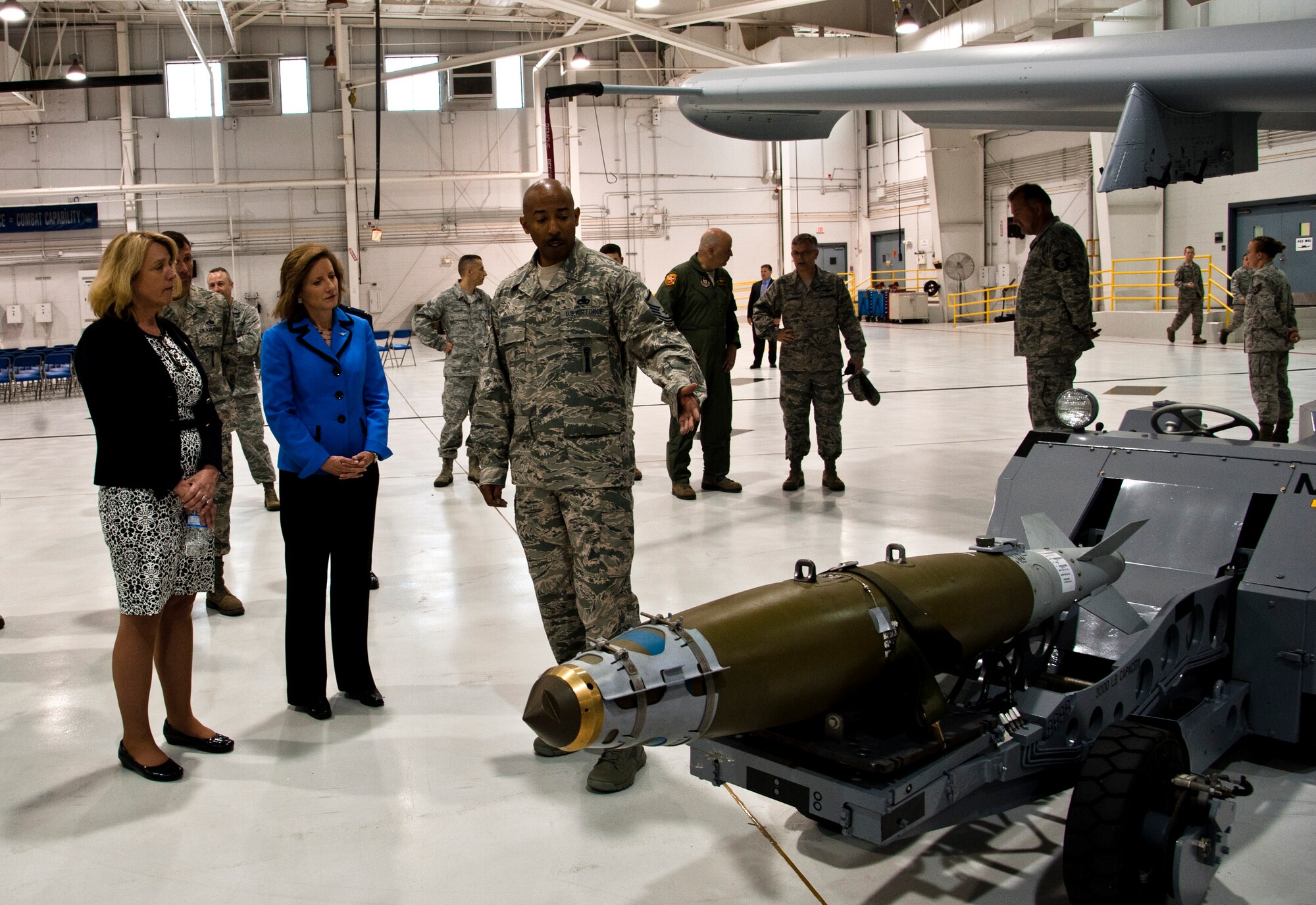 Tech. Sgt. Travis Patterson, 442nd Security Forces Squadron, shares his experiences as a security forces member with Secretary of the Air Force Deborah James and Congresswoman Vicky Hartzler (MO-4) May 29, 2014 at Whiteman Air Force Base, Mo. James and Hartzler visited Whiteman to learn about the installation’s various capabilities and meet the people who make the mission happen. (U.S. Air Force photo by Senior Airman Daniel Phelps/Released)
140529-F-OW876-085 Master Sgt. Transia Harris, 442nd Detachment 303 weapons loader, explains how as an active-duty servicemember he is attached to a Reserve unit to Secretary of the Air Force Deborah James and Congresswoman Vicky Hartzler (MO-4) May 29, 2014 at Whiteman Air Force Base, Mo. James and Hartzler visited Whiteman to learn about the installation’s various capabilities and meet the people who make the mission happen. (U.S. Air Force photo by Senior Airman Daniel Phelps/Released)
