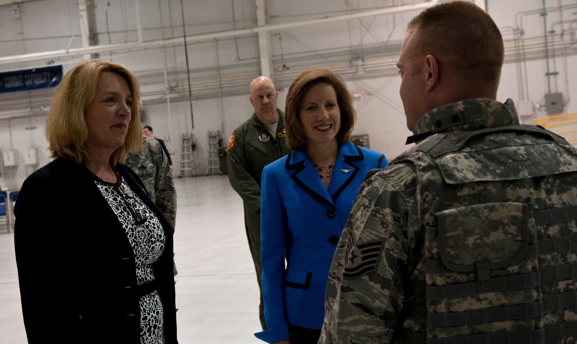 Tech. Sgt. Travis Patterson, 442nd Security Forces Squadron, shares his experiences as a security forces member with Secretary of the Air Force Deborah James and Congresswoman Vicky Hartzler (MO-4) May 29, 2014 at Whiteman Air Force Base, Mo. James and Hartzler visited Whiteman to learn about the installation’s various capabilities and meet the people who make the mission happen. (U.S. Air Force photo by Senior Airman Daniel Phelps/Released)