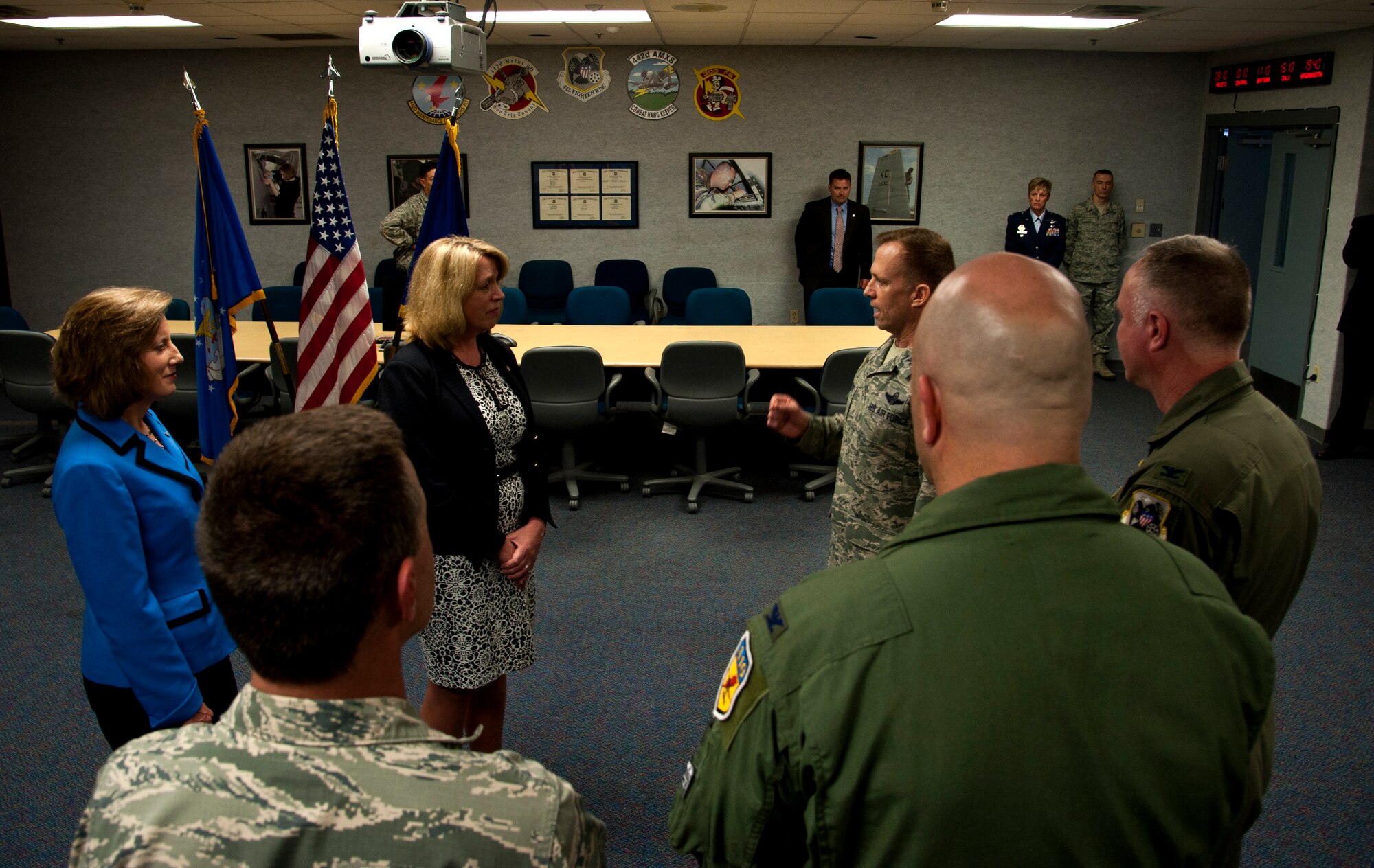 Col. Hubie Hegvedt, 442nd Fighter Wing commander, shares with Secretary of the Air Force Deborah James and Congresswoman Vicky Hartzler (MO-4) the importance and capabilities of the 442nd FW May 29, 2014 at Whiteman Air Force Base, Mo.  James and Hartzler visited Whiteman to learn about the installation’s various capabilities and meet the people who make the mission happen. (U.S. Air Force photo by Senior Airman Daniel Phelps/Released)