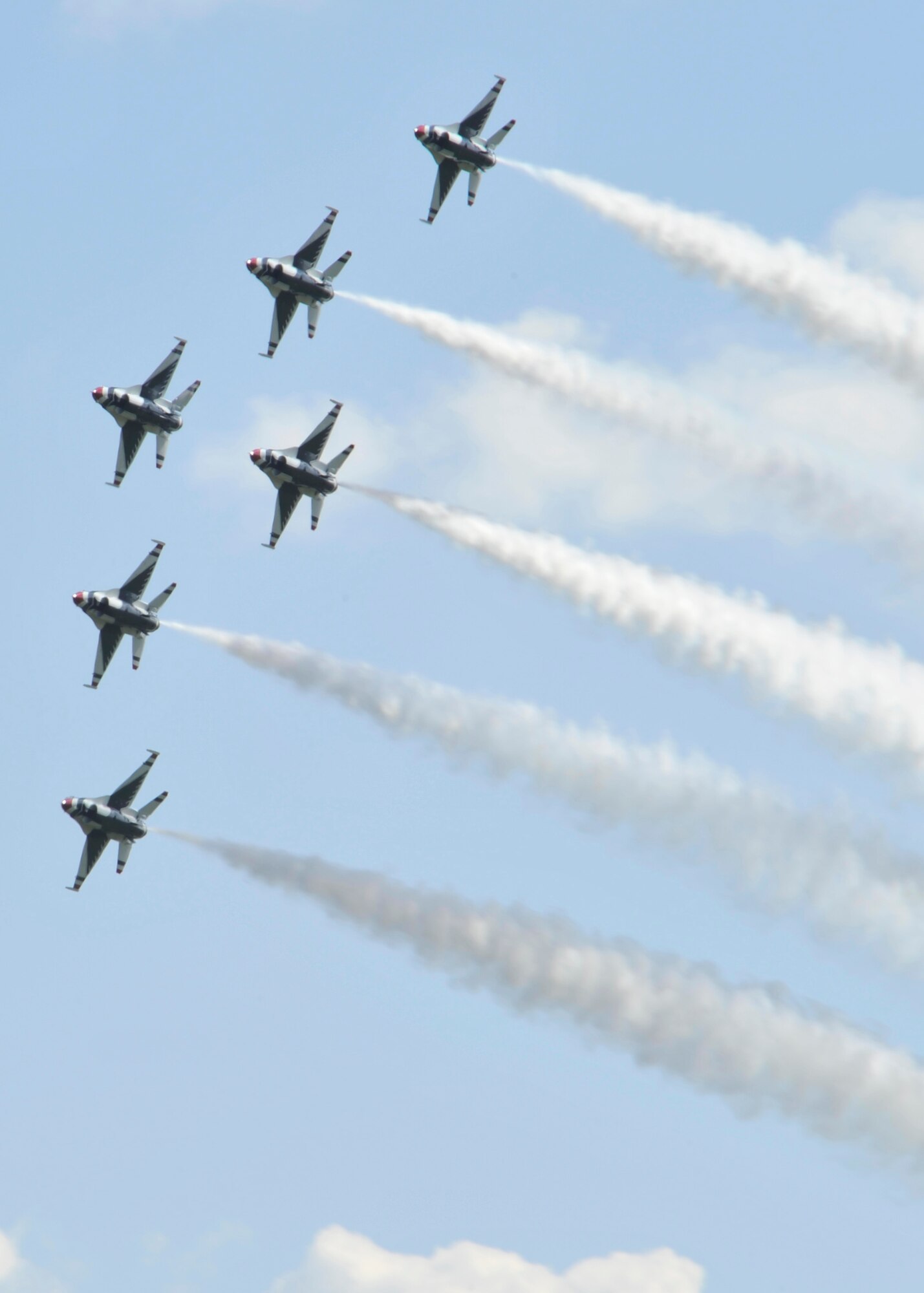 The Air Force Thunderbirds aerial demonstration team flies in formation during SkyFest 2014 at Fairchild Air Force Base, Wash., May 31, 2014. The team performs precision aerial maneuvers demonstrating the capabilities of Air Force high performance aircraft to people throughout the world. (U.S. Air Force photo by Senior Airman Mary O'Dell/Released)