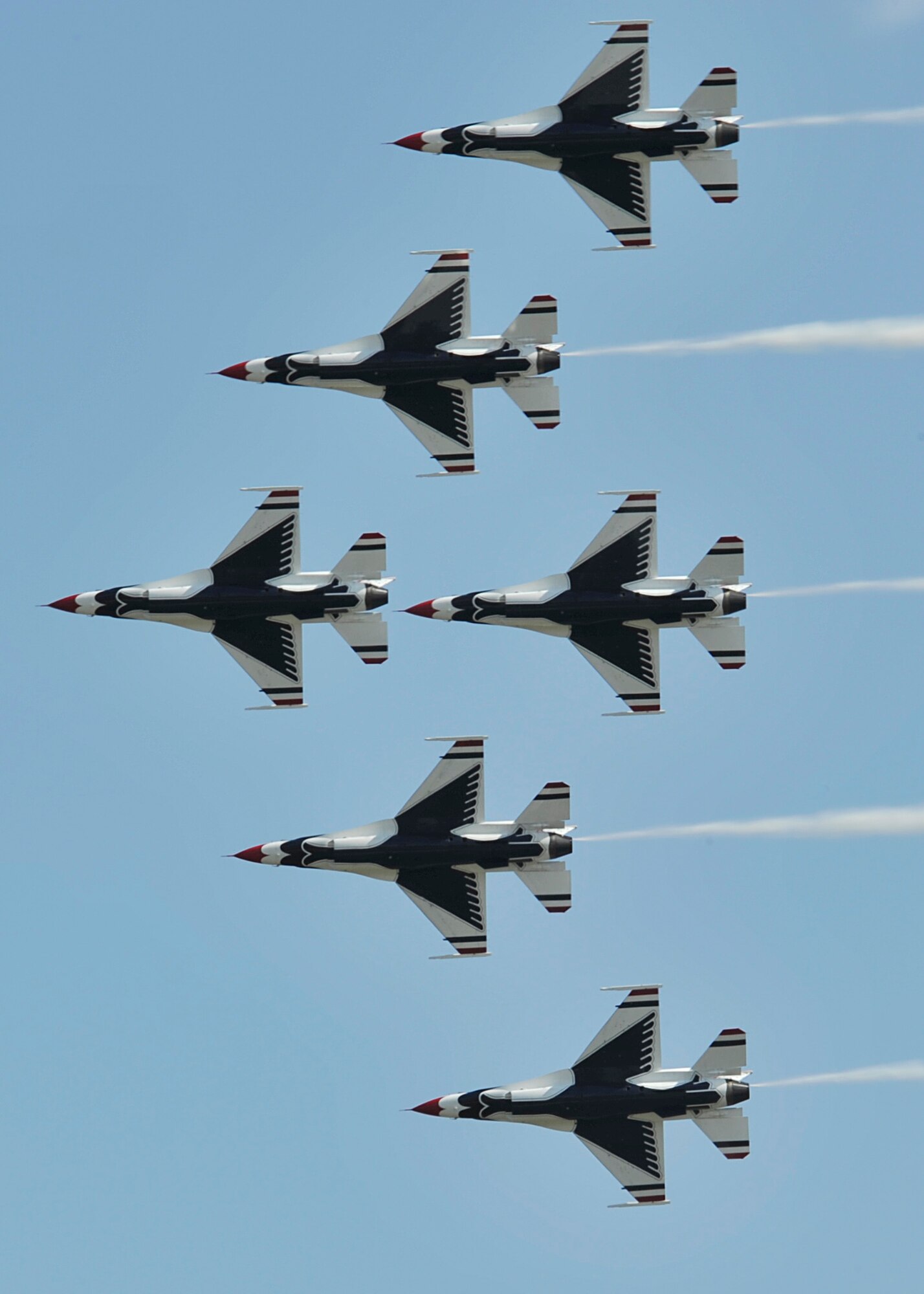 The Air Force Thunderbirds aerial demonstration team flies in formation during SkyFest 2014 at Fairchild Air Force Base, Wash., May 31, 2014. The Thunderbirds is an Air Combat Command unit composed of eight pilots, including six demonstration pilots, four support officers, three civilians and more than 130 enlisted personnel performing in 25 career fields. (U.S. Air Force photo by Senior Airman Mary O'Dell/Released)