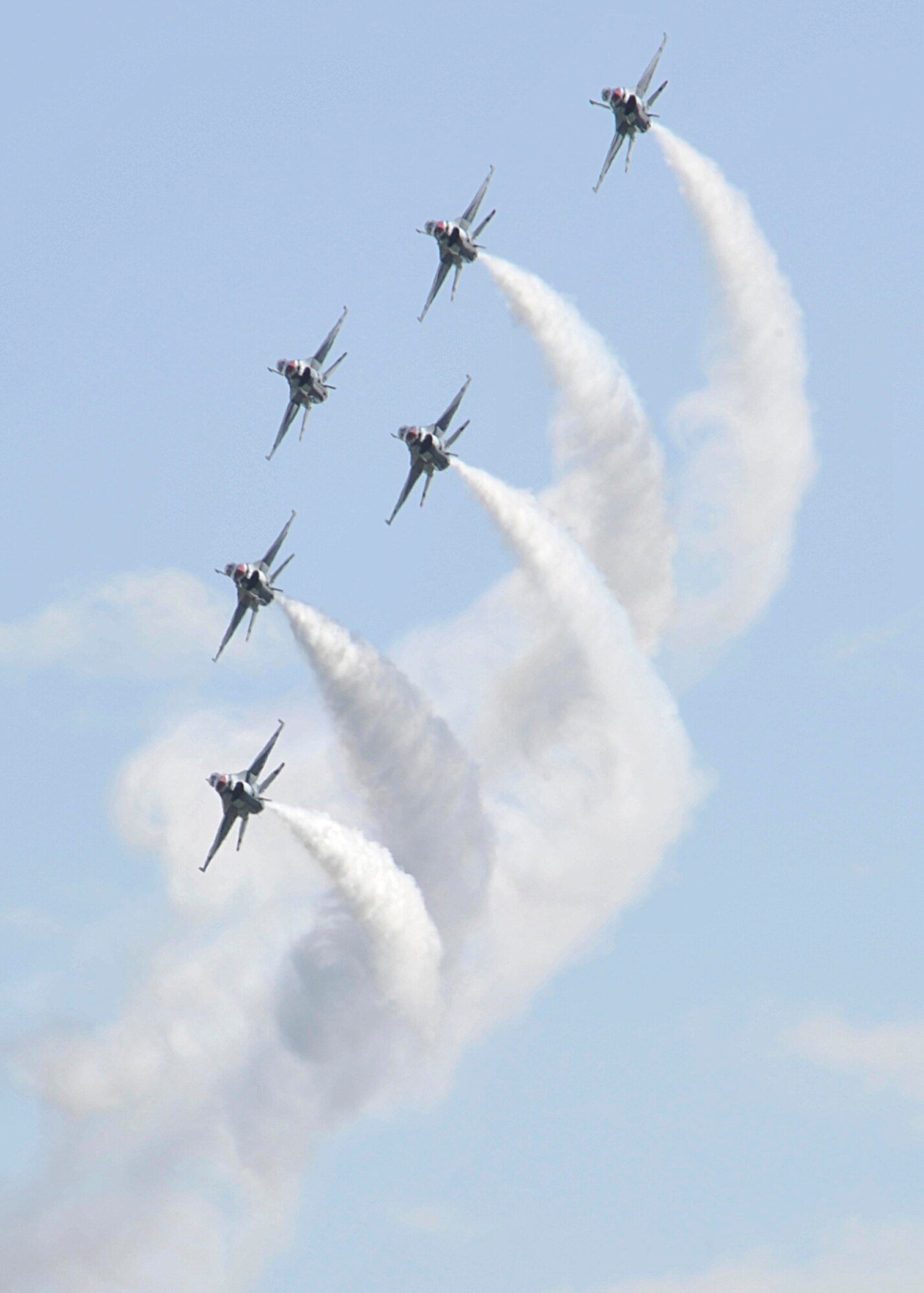 The Air Force Thunderbirds aerial demonstration team flies in formation during SkyFest 2014 at Fairchild Air Force Base, Wash., May 31, 2014. The Thunderbirds have flown the F-16 Fighting Falcon since August 1982, more than half of the team's history. SkyFest hosted more 210,000 people, giving the local and regional community the opportunity to view Airmen and their resources. (U.S. Air Force photo by Senior Airman Mary O'Dell/Released)