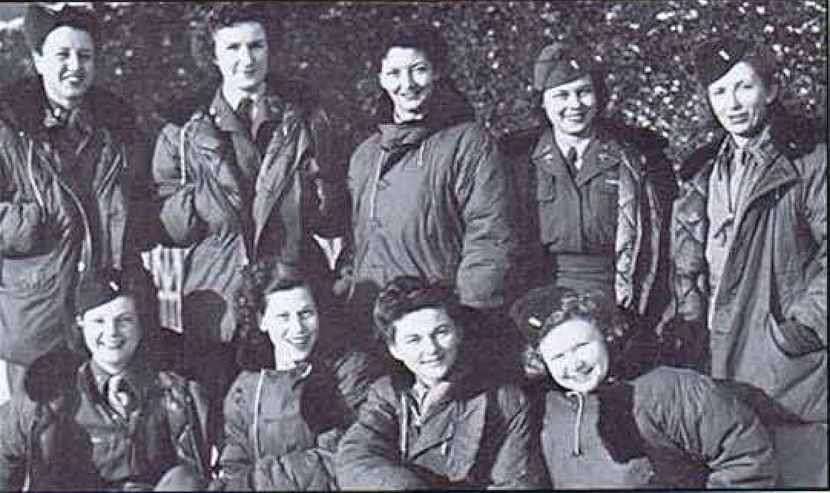 Nurses of first air evacuation flights on D-Day: l-R: Irene Schultz, Helen Rarick, Vangie Comeaux, Mable Strube, Helen Morison, Betty Williamson, Vee Moss, Mary Bell Fraser, Winnie Plutz of 813th - Le Bourget, Paris , France.  (Photo credit: WWII Flight Nurse Association, History of Air Evacuation, 1942-1989)