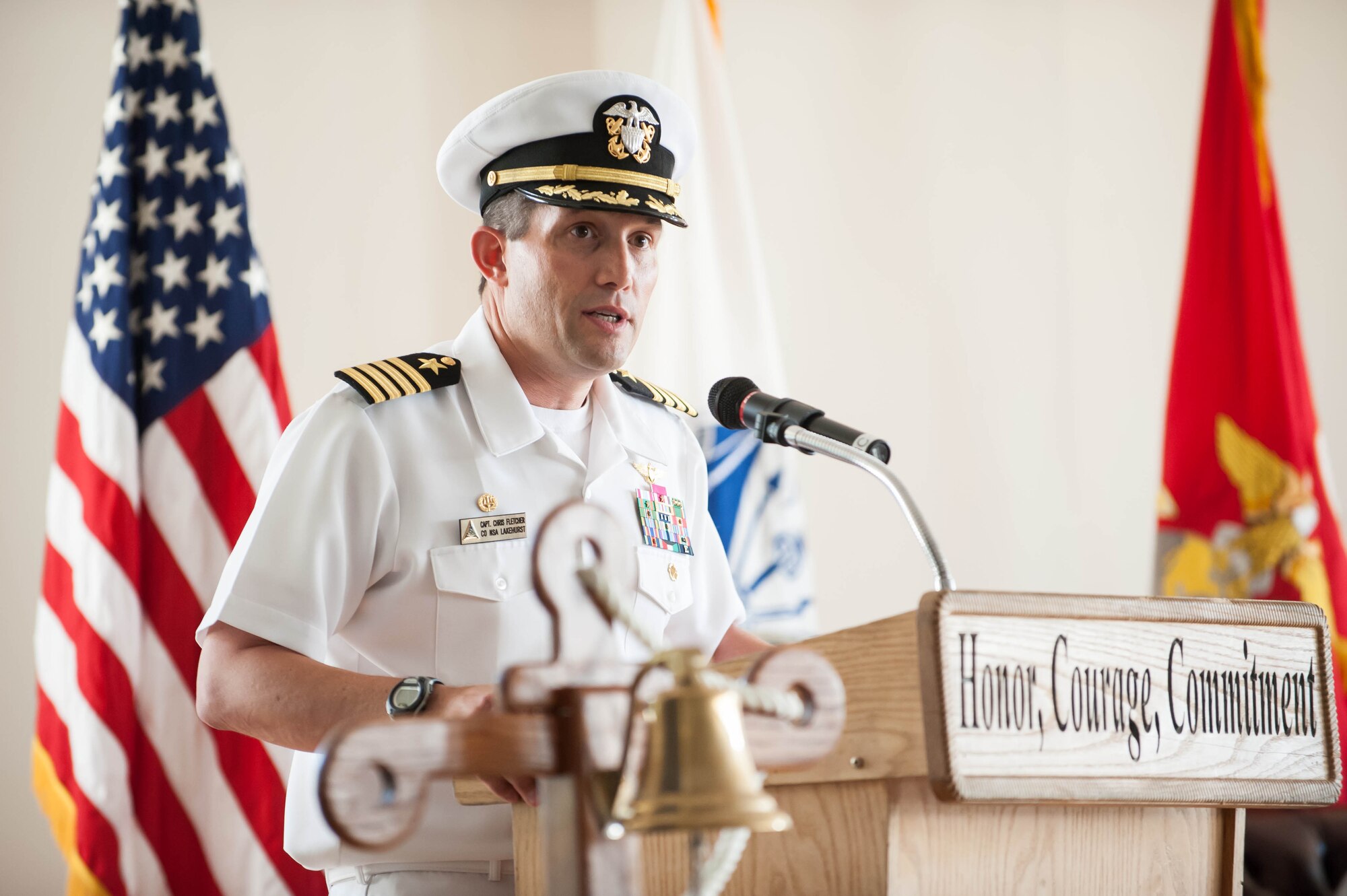 Navy Capt. Christopher Fletcher, Joint Base McGuire-Dix-Lakehurst deputy commander, gives a commemorative speech at the Battle of Midway ceremony June 3, 2014, at the Flight Deck, JB MDL, N.J. Fletcher focused on the service members who helped win the battle decisively and ultimately turn the tides of World War II. (U.S. Air Force photo by Airman 1st Class Sean M. Crowe/Released)