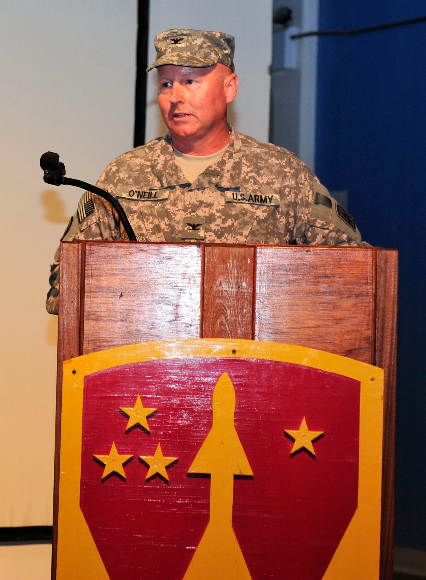 U.S. Army Col. Edward O’Neil, 108th Air Defense Artillery Brigade commander, speaks to members of the audience during a transfer of authority ceremony at Al Udeid Air Base, Qatar, May 30, 2014. The 108th ADA is deployed from Fort Bragg, North Carolina.(U.S. Air Force photo by Senior Airman Colin Cates)