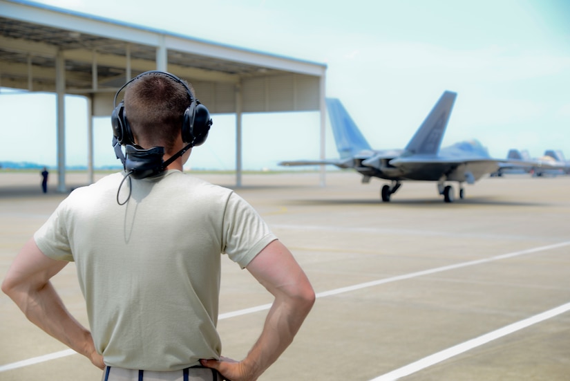 U.S. Air Force Staff Sgt. Justin Hubbard, 94th Fighter Squadron dedicated crew chief, watches his aircraft depart for a training sortie at Langley Air Force Base, Va., June 4, 2014. Cited for his work ethic and dedication to achieve excellence in all maintenance areas, Hubbard earned the 2013 Chief Master Sergeant of the Air Force Thomas N. Barnes Crew Chief of Year Award. (U.S. Air Force photo by Staff Sgt. Antoinette Gibson/Released)