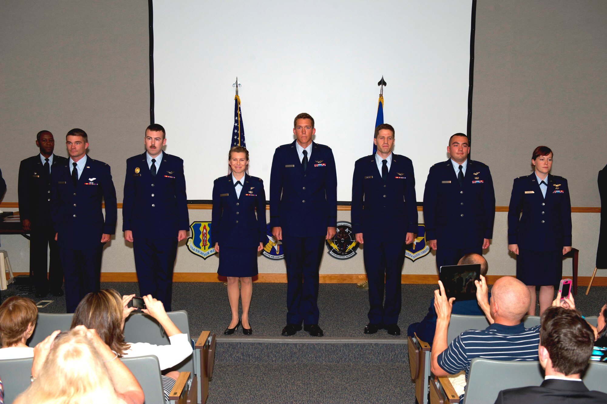 Seven Team Tyndall Airmen stand at attention during their Air Battle Manager Class 14012 graduation ceremony June 4. The class is housed at the 337th Air Control Squadron, which is a tenant unit here assigned to the 33rd Operations Group, 33rd Fighter Wing, Eglin Air Force Base, Fla. (U.S. Air Force photo by Senior Airman Christopher Reel) 