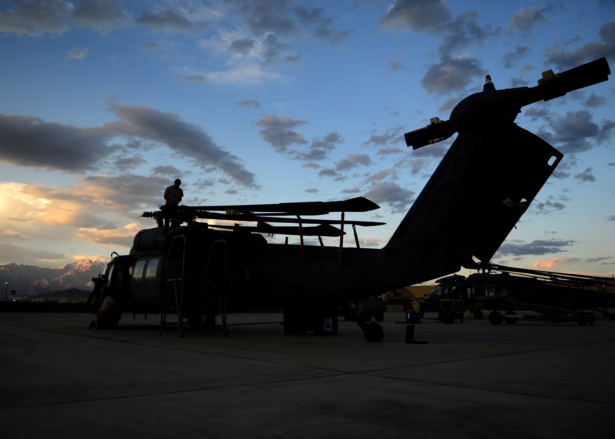 U. S. Air Force Airmen from the 455th Expeditionary Aircraft Maintenance Squadron, break down an HH-60G Pave Hawk helicopter at Bagram Airfield, Afghanistan June 2, 2014.  The unit is preparing the helicopter for redeployment to their home base Moody Air Force Base, Ga.  Helicopter maintainers here ensure Bagram’s combat search and rescue helicopters are ready to fly at a moment’s notice. (U.S. Air Force photo by Staff Sgt. Evelyn Chavez/Released)
