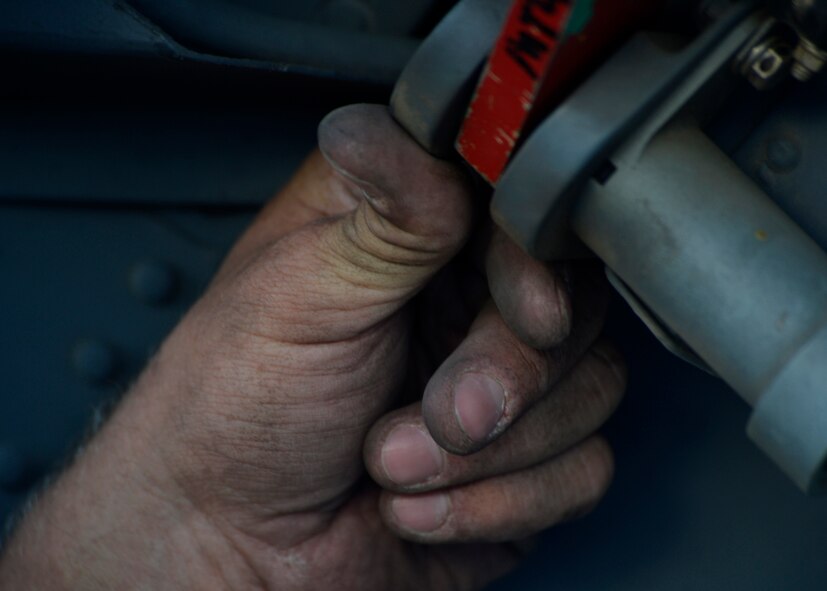 A U.S. Air Force Airman from the 455th Expeditionary Aircraft Maintenance Squadron, tightens a bolt an HH-60G Pave Hawk helicopter at Bagram Airfield, Afghanistan June 2, 2014.  The unit is preparing their helicopters for redeployment to their home base, Moody Air Force Base, Ga.  Maintainers here work a non-stop alert schedule to maintain high mission-capable ratings and are ready to respond 24 hours a day, seven days a week. (U.S. Air Force photo by Staff Sgt. Evelyn Chavez/Released)