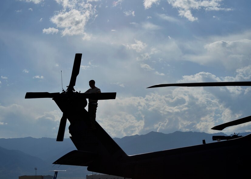 U. S. Air Force Airmen from the 455th Expeditionary Aircraft Maintenance Squadron, prepare an HH-60G Pave Hawk helicopter to redeploy to their home station, Moody Air Force Base, Ga.  The maintainers spend countless hours breaking down and washing the helicopters to be ready for loading on C-17 Globemaster aircrafts. (U.S. Air Force photo by Staff Sgt. Evelyn Chavez/Released) 