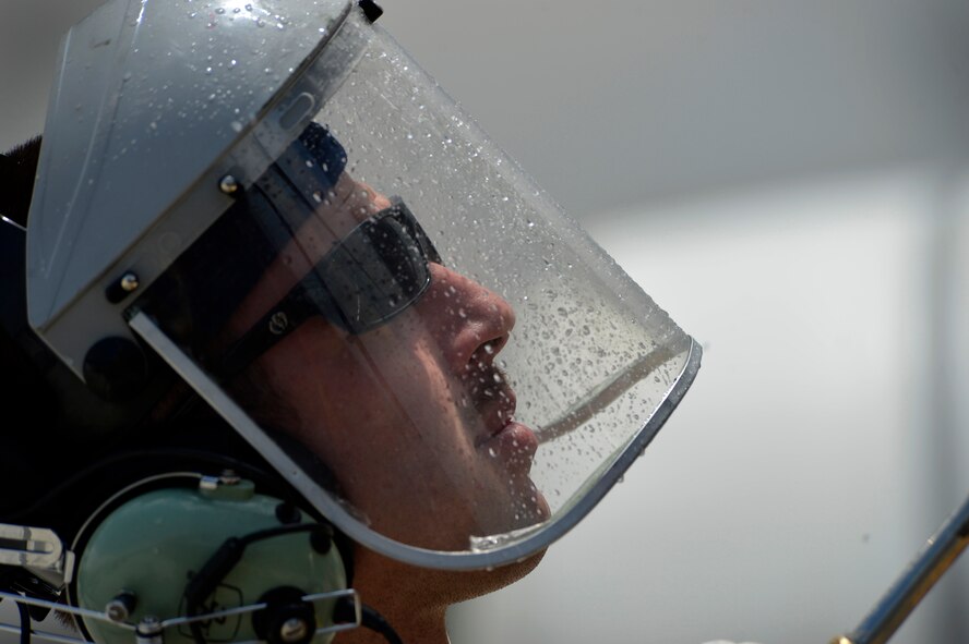 U. S. Air Force Senior Airman Lucas Stone, 455th Expeditionary Aircraft Maintenance Squadron crew chief, washes an HH-60G Pave Hawk at Bagram Airfield, Afghanistan June 2, 2014. The Pave Hawk must be cleaned thoroughly and then folded up in order to be shipped back to Moody Air Force Base, Ga. Lucas is deployed from the 41st Rescue Squadron and a native of Hershey, Pa. (U.S. Air Force photo by Staff Sgt. Evelyn Chavez/Released)