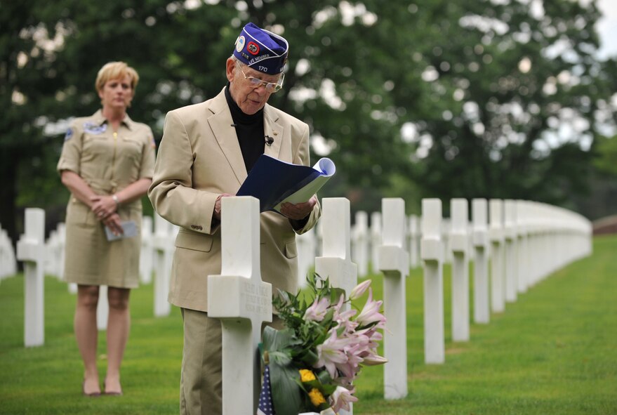 Leslie Cruise, a World War II veteran, reads the paratroopers creed during a wreath laying ceremony at Lorraine American National Cemetery and Memorial, St. Avold, France, June 2, 2014. Seventy years ago on June 7, 1944 Pvt. Richard Vargas saved Cruise’s life during the invasion of Normandy. Cruise went to France several times prior to this visit looking for his friend’s grave in order to say thank you. (U.S. Air Force photo/Senior Airman Hailey Haux)