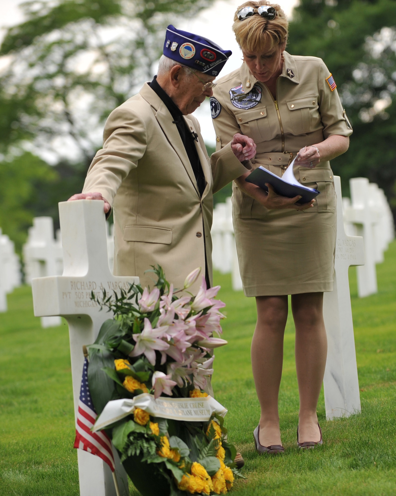 Leslie Cruise, a World War II veteran, reads the paratroopers creed during a wreath laying ceremony at Lorraine American National Cemetery and Memorial, St. Avold, France, June 2, 2014. Seventy years ago on June 7, 1944 Pvt. Richard Vargas saved Cruise’s life during the invasion of Normandy. Cruise went to France several times prior to this visit looking for his friend’s grave in order to say thank you. (U.S. Air Force photo/Senior Airman Hailey Haux)