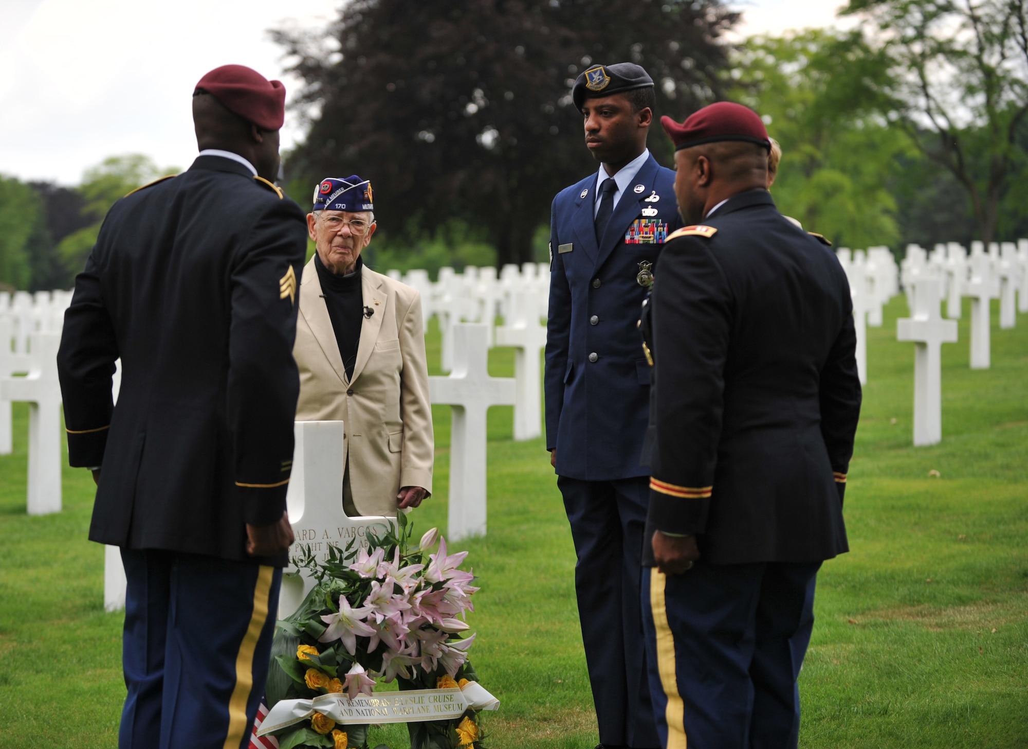 Leslie Cruise, a World War II veteran, and members from the 5th Quartermaster Theater Aerial Delivery Company, 435th Air Ground Operations Wing’s Contingency Response Group and 21st Theater Sustainment Command lay down a wreath in honor of Pvt. Richard Vargas at Lorraine American National Cemetery and Memorial, St. Avold, France, June 2, 2014. Seventy years ago on June 7, 1944 Pvt. Richard Vargas saved Cruise’s life during the invasion of Normandy. Cruise went to France several times prior to this visit looking for his friend’s grave in order to say thank you. (U.S. Air Force photo/Senior Airman Hailey Haux)