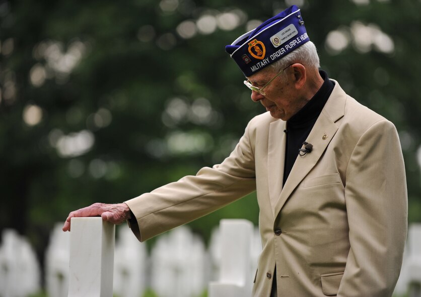 Leslie Cruise, a World War II veteran, pays his respects to the man who saved his life seventy years ago with a wreath laying ceremony at Lorraine American National Cemetery and Memorial, St. Avold, France, June 2, 2014. Seventy years ago on June 7, 1944 Pvt. Richard Vargas saved Cruise’s life during the invasion of Normandy. Cruise went to France several times prior to this visit looking for his friend’s grave in order to say thank you. (U.S. Air Force photo/Senior Airman Hailey Haux)