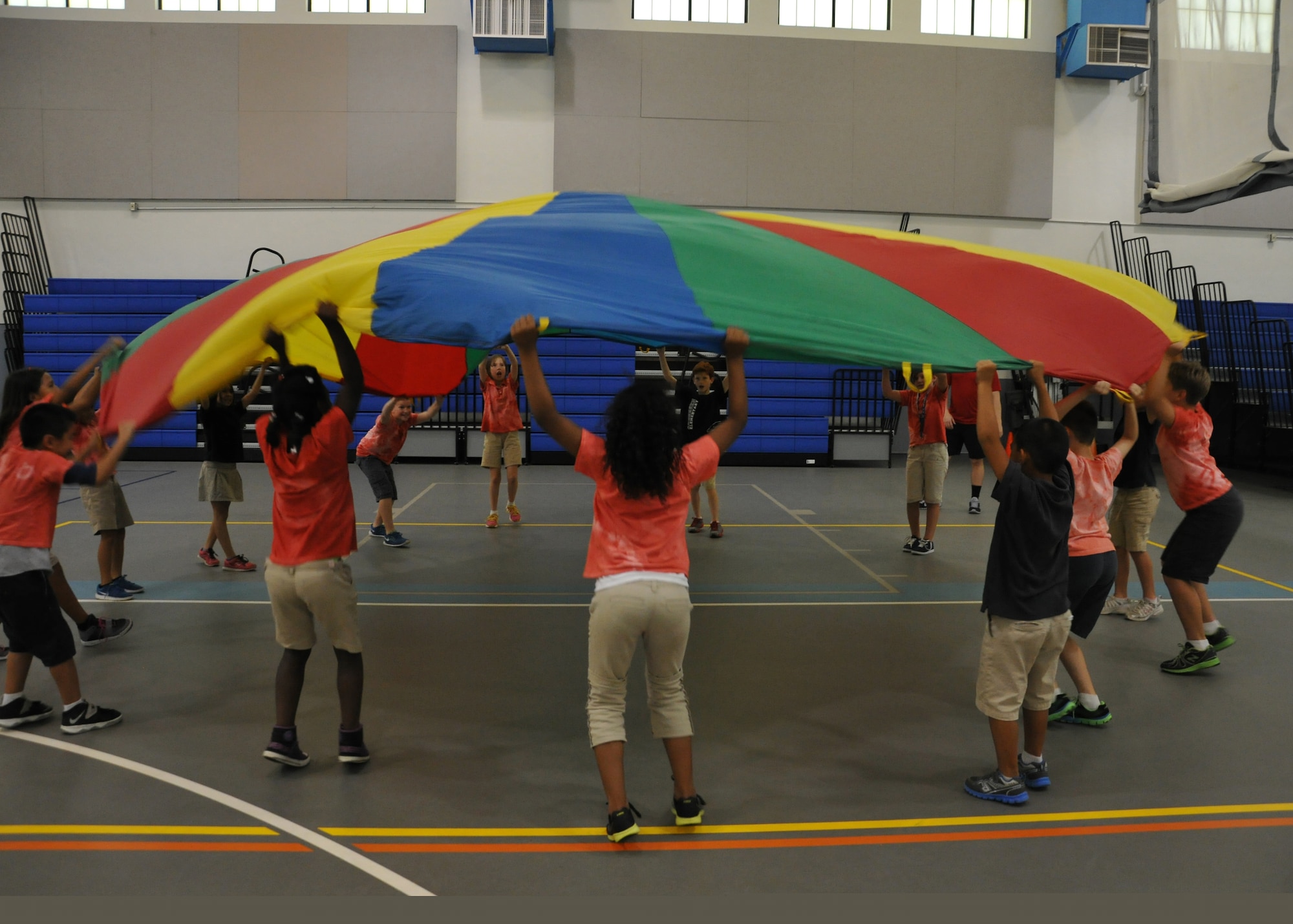 Children from Andersen Elementary School participate in a game during fitness fun day May 30, 2014, on Andersen Air Force Base, Guam. Fitness day is held once a year before summer break and is offered to all students in Kindergarten through fifth grade. (Senior Airman Cierra Presentado/Released