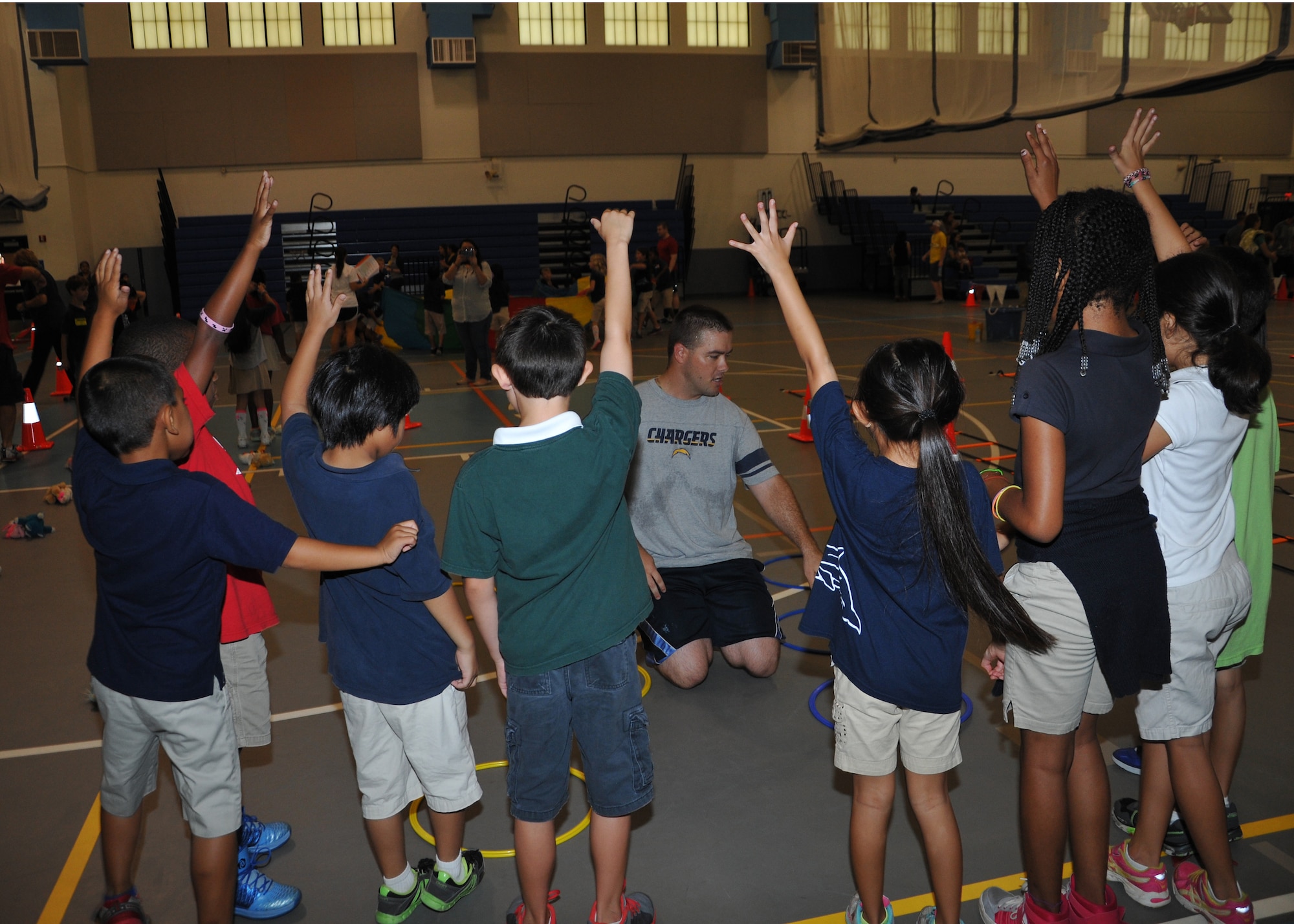 Children from Andersen Elementary School participate in fitness fun day May 30, 2014, on Andersen Air Force Base, Guam. The children played a variety of games led by  Andersen volunteers. (U.S. Air Force photo by Senior Airman Cierra Presentado/Released)