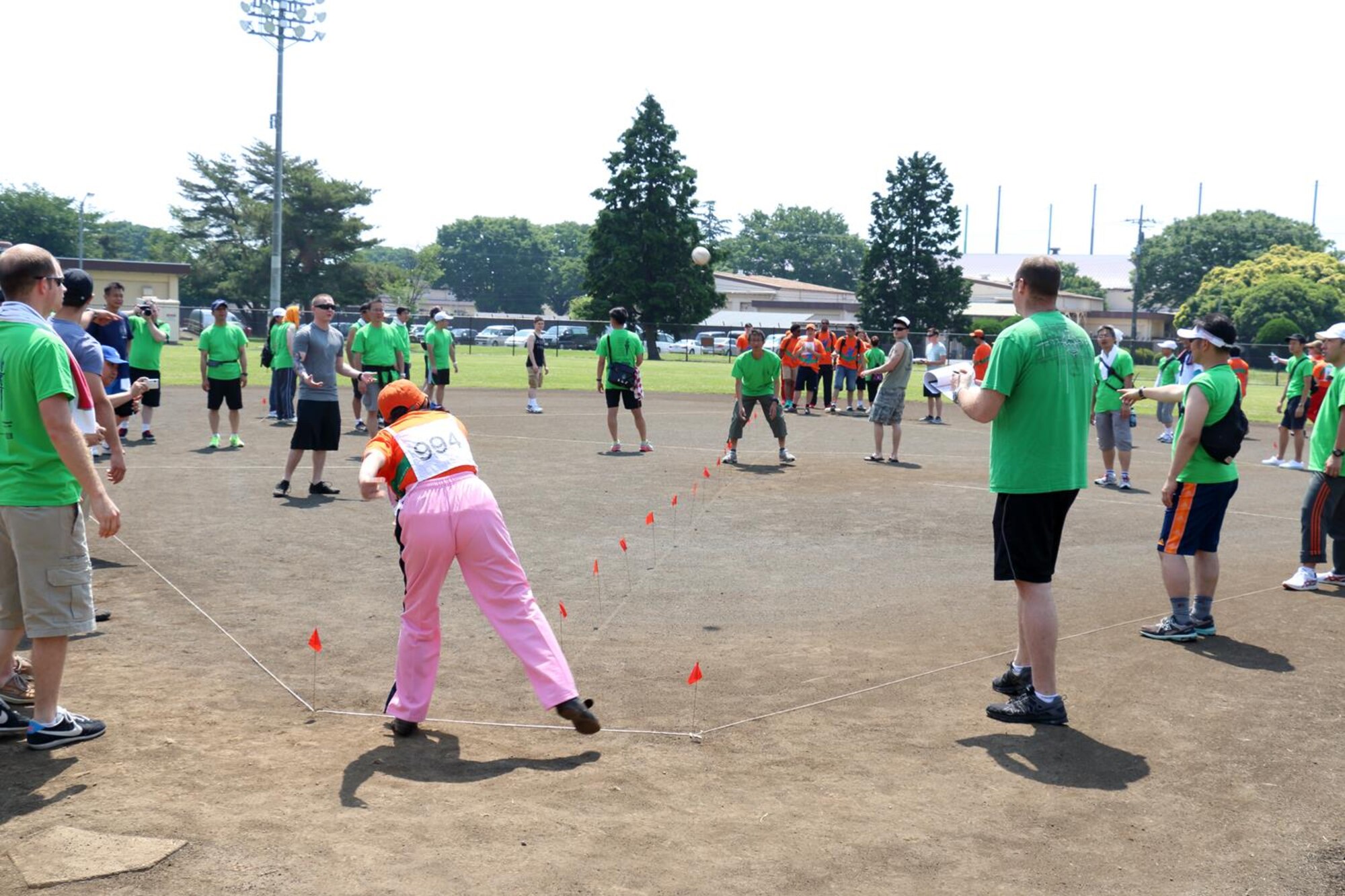 An athlete throws a softball at the softball toss event during the Special Olympics at Yokota Air Base, Japan, May 31, 2014. In addition to the softball throw, athletes participated in a variety of events including basketball, swimming and bowling. (Courtesy photo Staff Sgt. Jeffrey MacHott/Released)