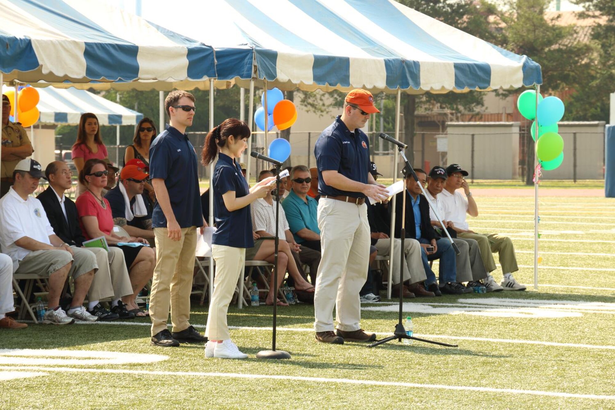 Col. Mark August, 374th Airlift Wing commander, speaks at the Special Olympic opening ceremony at Yokota Air Base, Japan, May 31, 2014. August thanked all athletes and families at the event for their support and participation. (Courtesy photo Staff Sgt. Jeffrey MacHott/Released)