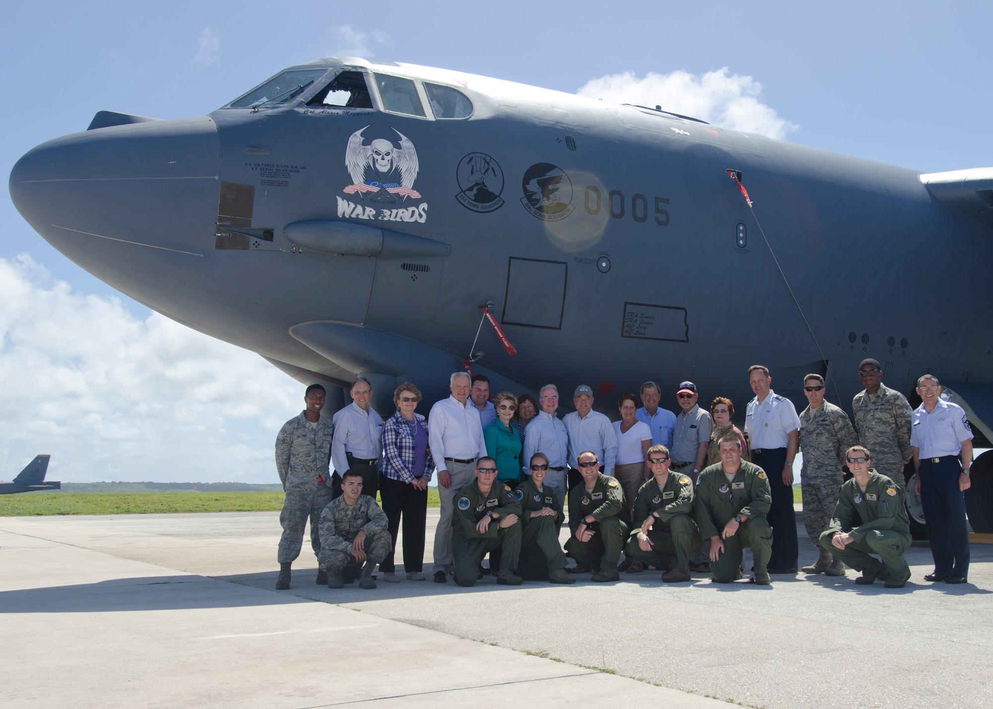 U.S. Congress members, their spouses and staff take a group photo with Team Andersen leadership and Airmen by a B-52 Stratofortress June 2, 2014, on Andersen Air Force Base, Guam. The visitors toured several facilities including the Guam National Guard Readiness Center, Governor’s Complex and the Terminal High Altitude Area Defense system.  This trip was a part of a fact-finding visit to the Pacific and Asia in order to seek solutions to increase America's competitiveness in the classroom, workplace, and international trade market. (U.S. Air Force photo by Senior Airman Katrina M. Brisbin/Released)