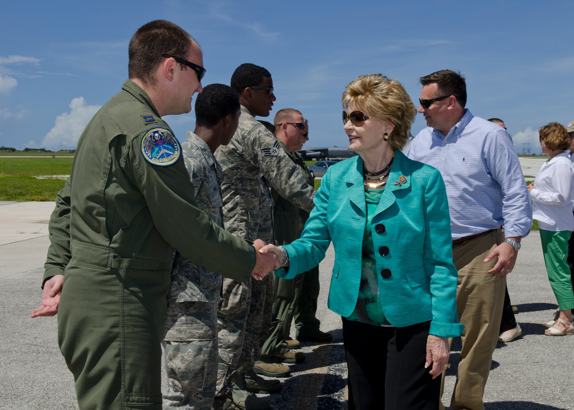 Andersen Airmen greet U.S. Congress members during a tour June 2, 2014, on Andersen Air Force Base, Guam. Eight Congress members, their spouses and staffs visited Andersen as part of a fact-finding visit to the Pacific and Asia in order to seek solutions to increase America's competitiveness in the classroom, workplace, and international trade market. (U.S. Air Force photo by Senior Airman Katrina M. Brisbin/Released)