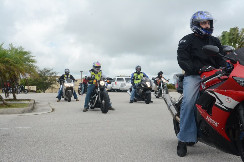 Members of Team Andersen prepare to go on a motorcycle ride down Marine Corps Drive near Andersen Air Force Base, Guam on May 29, 2014. The 36th Contingency Response Group hosted a bike ride on Andersen to raise motorcycle safety awareness amongst riders on base. (U.S. Air Force photo by Airman 1st Class Adarius Petty/Released)