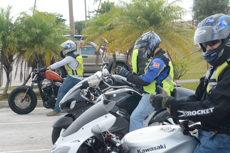 Members of Team Andersen prepare to go on a motorcycle ride down Marine Corps Drive near Andersen Air Force Base, Guam on May 29, 2014. The 36th Contingency Response Group hosted a bike ride on Andersen to raise motorcycle safety awareness amongst riders on base. (U.S. Air Force photo by Airman 1st Class Adarius Petty/Released)