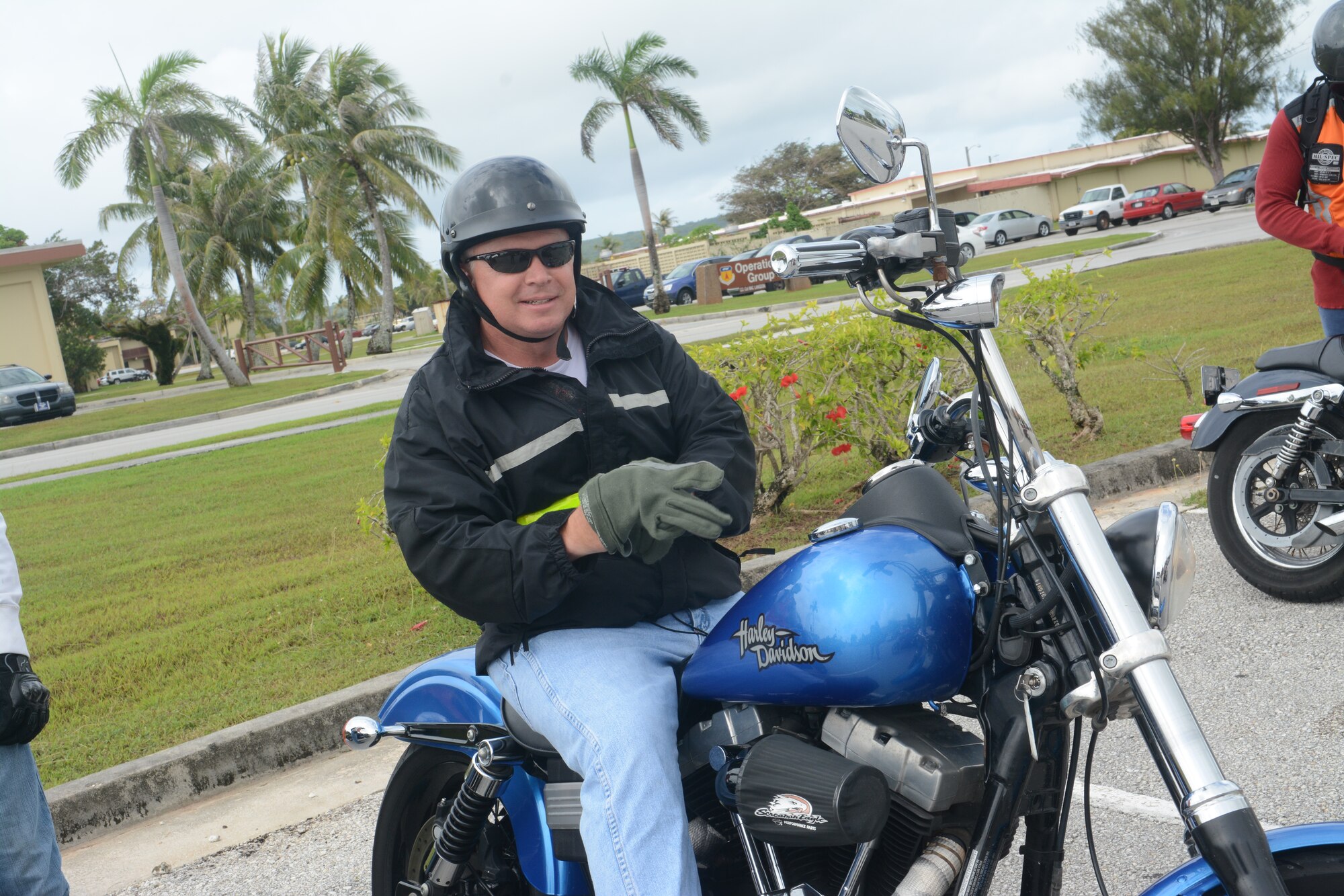 Col. Thomas Livingston, 36th Contingency Response Group Commander, prepares to go on a motorcycle ride on Andersen Air Force Base Guam, May 29, 2014. The 36th CRG hosted a bike ride on Andersen to raise motorcycle safety awareness amongst riders on base. (U.S. Air Force photo by Airman 1st Class Adarius Petty/Released)